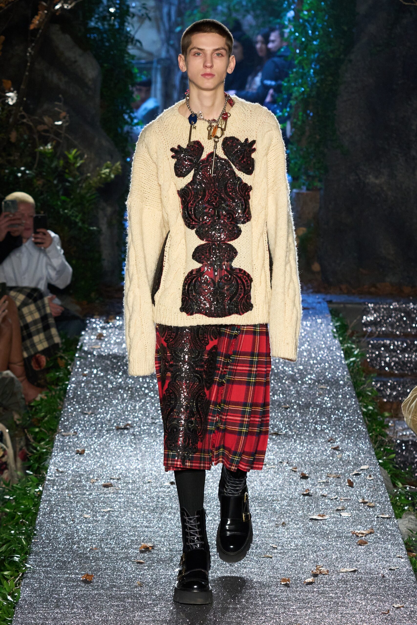 oversized beige sweater with plaid skirt