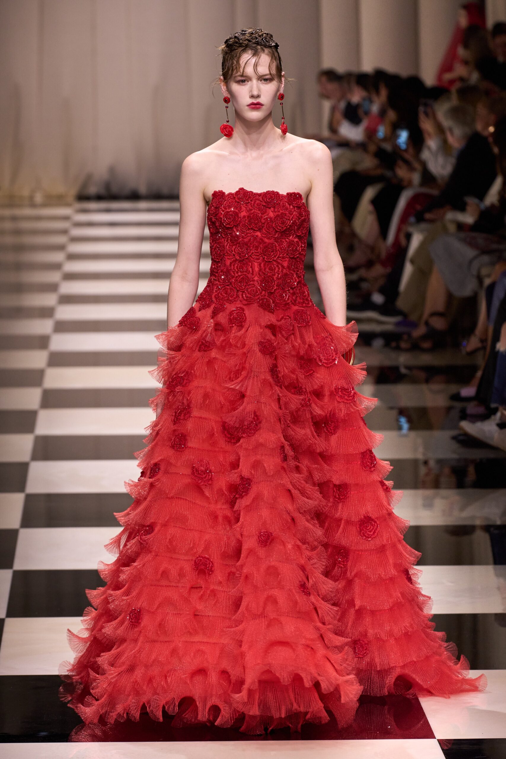 red ruffled strapless gown