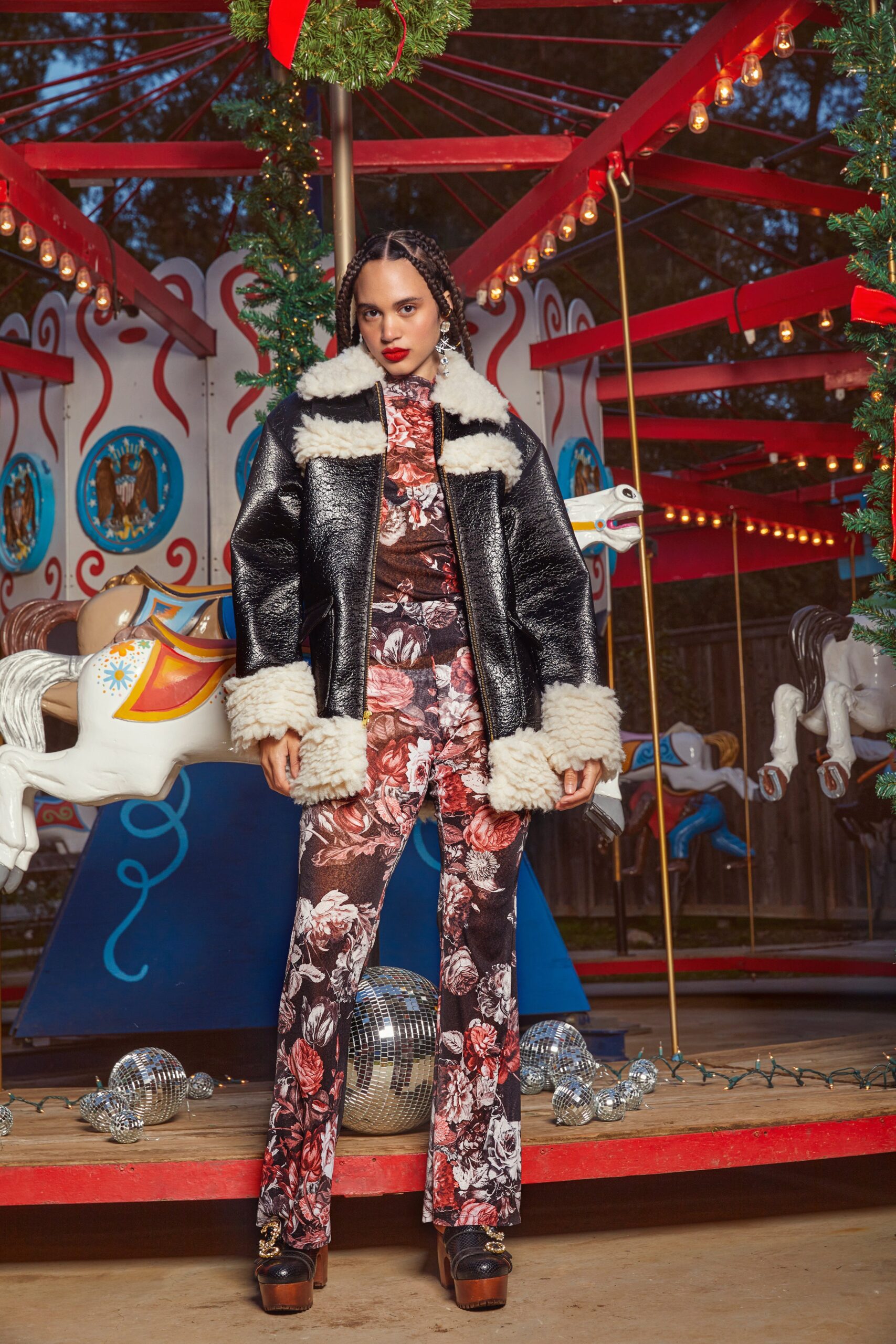 black faux-fur jacket and floral jumpsuit