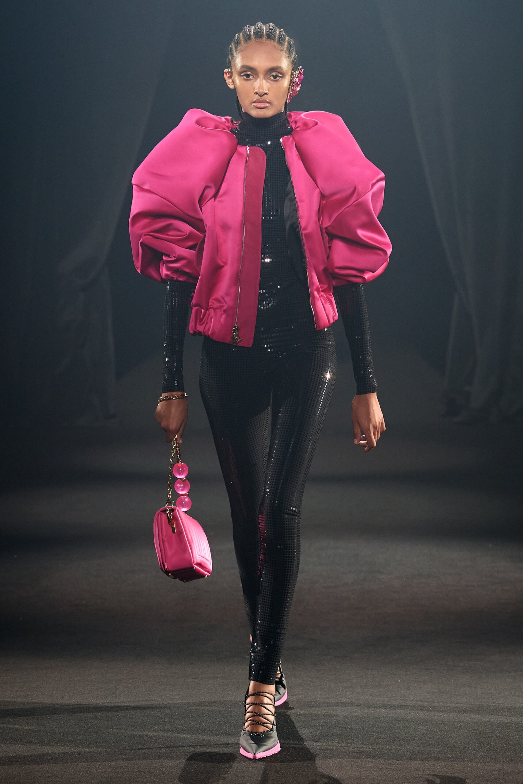 pink silk jacket and black vinyl catsuit