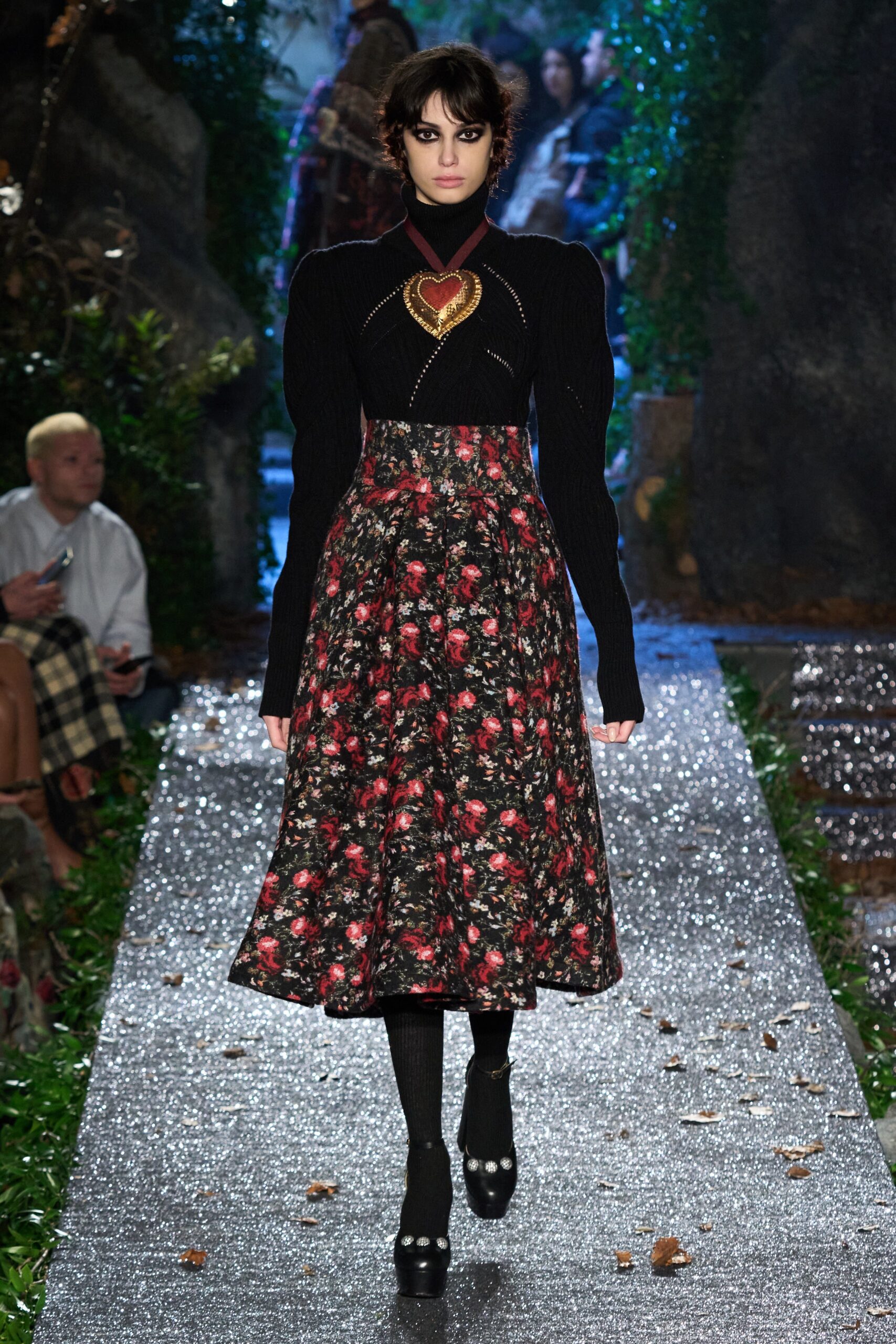 black fitted top and floral skirt