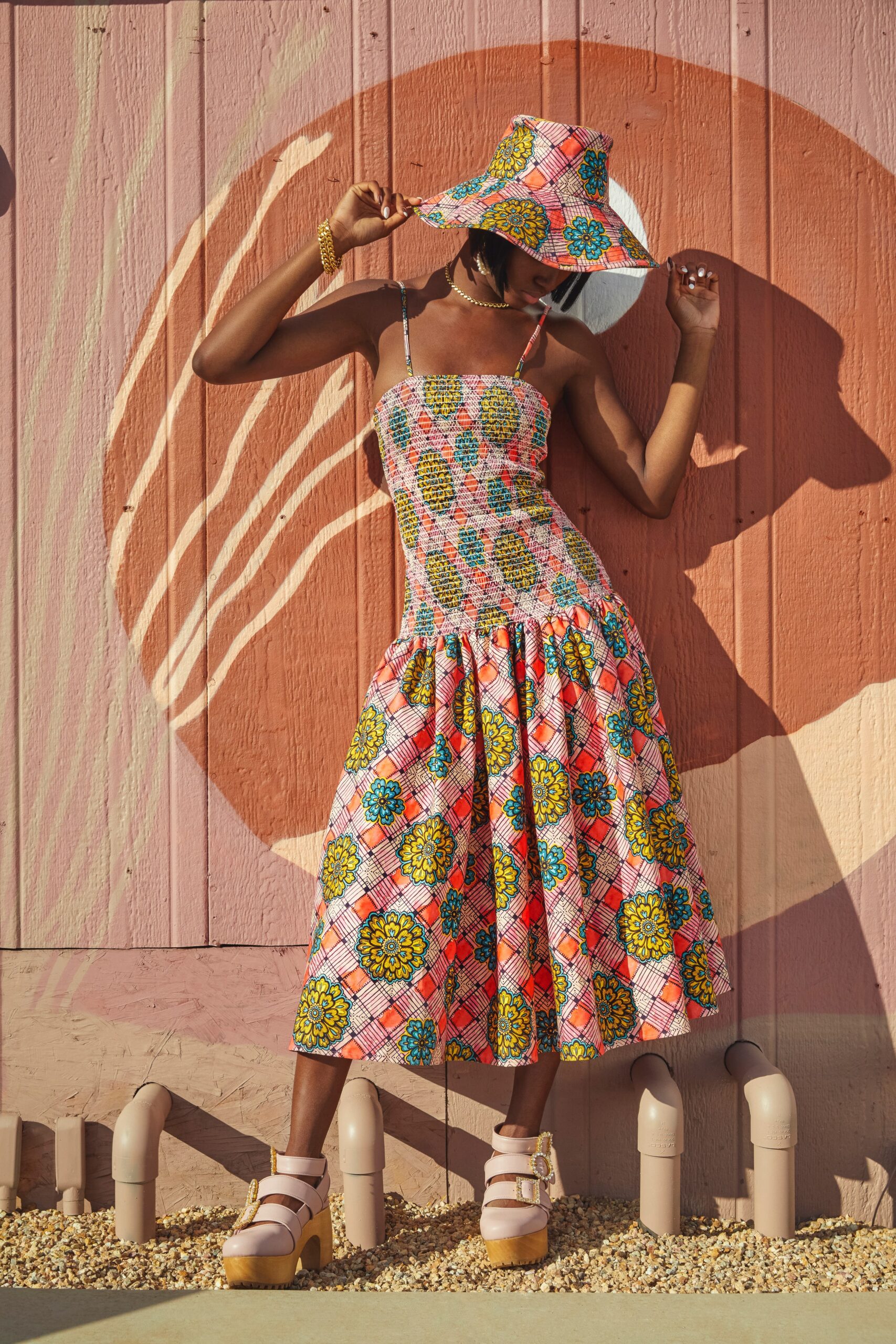 pink printed midi dress and hat