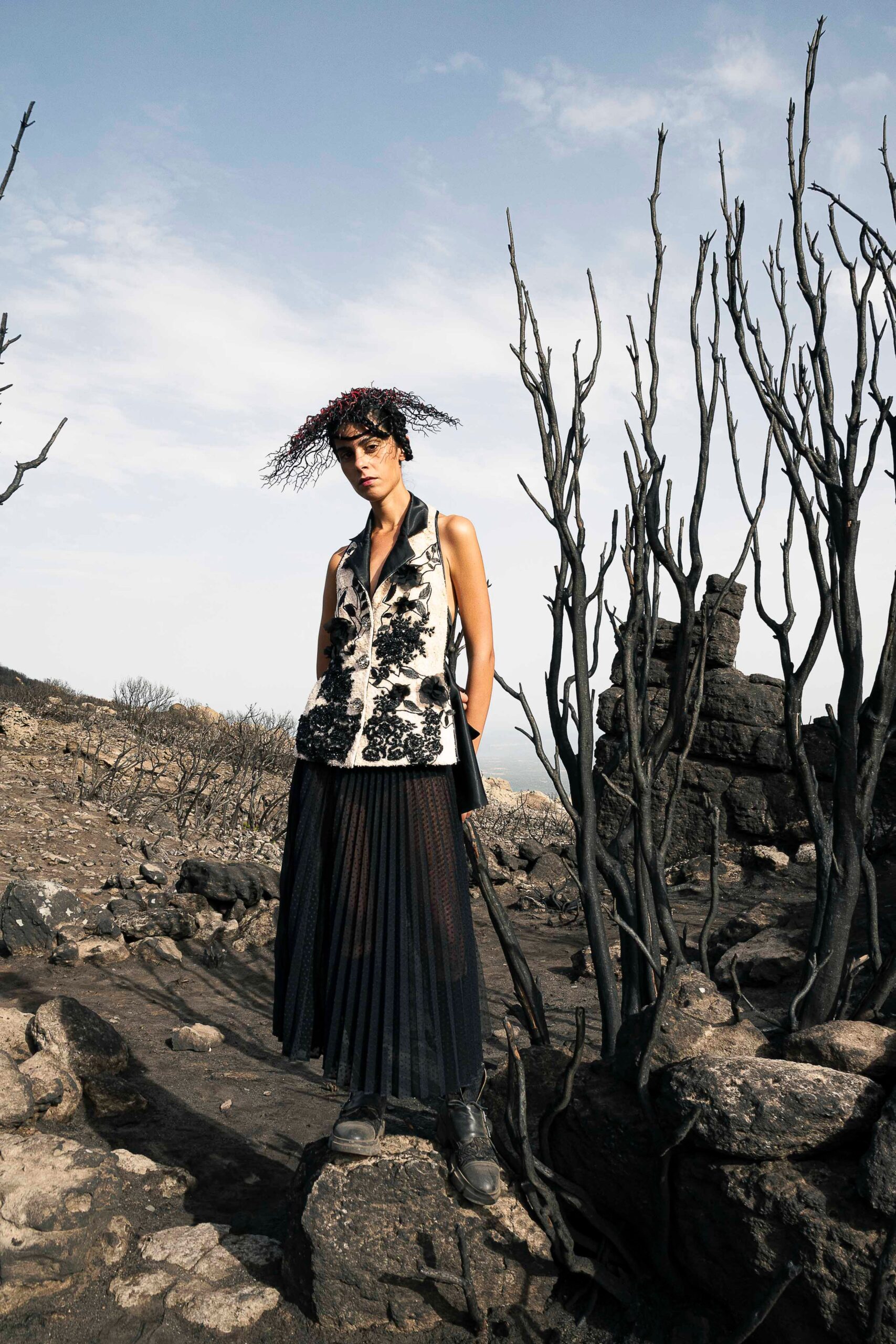 black and white embroidered top with pleated skirt