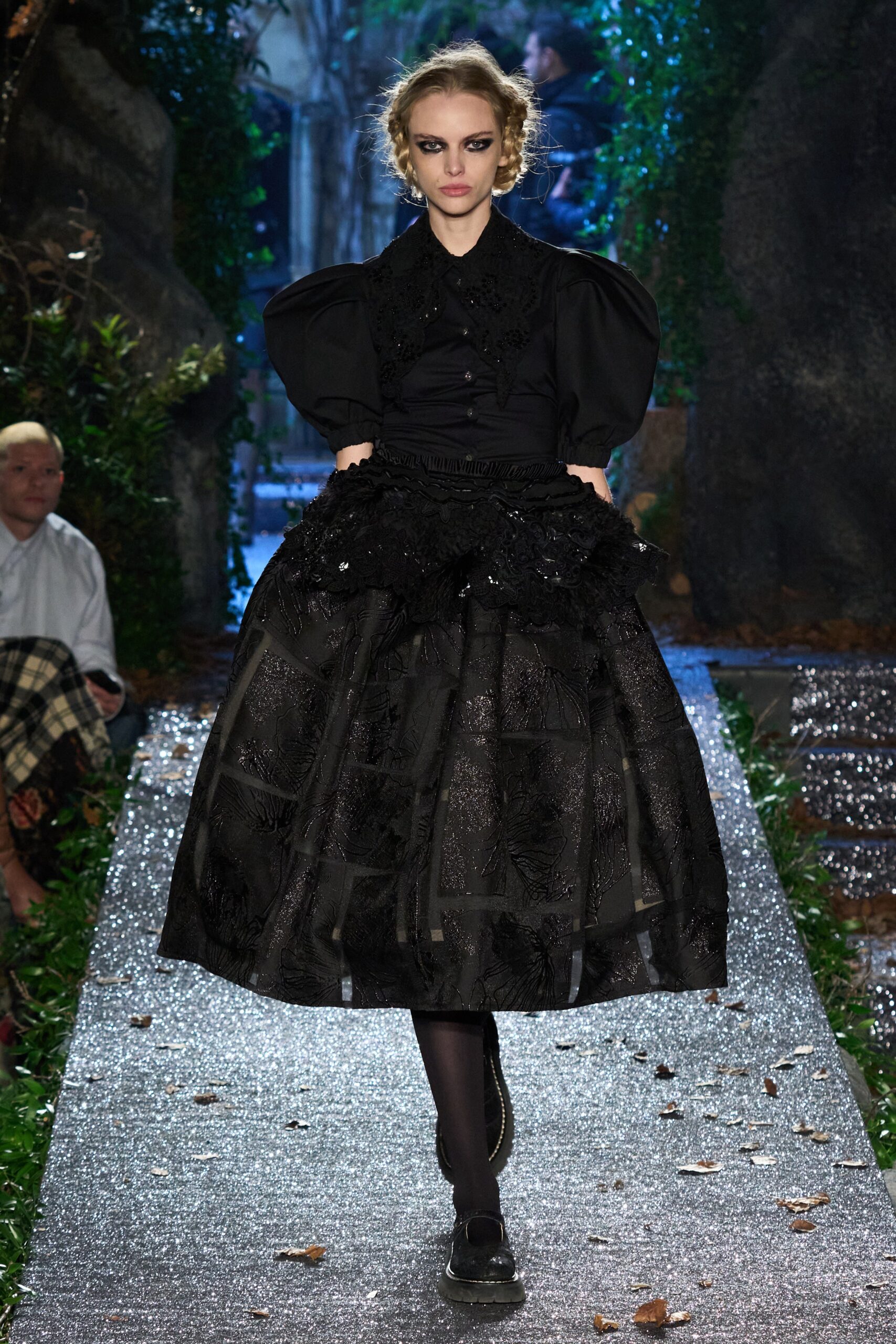 black blouse and embroidered skirt