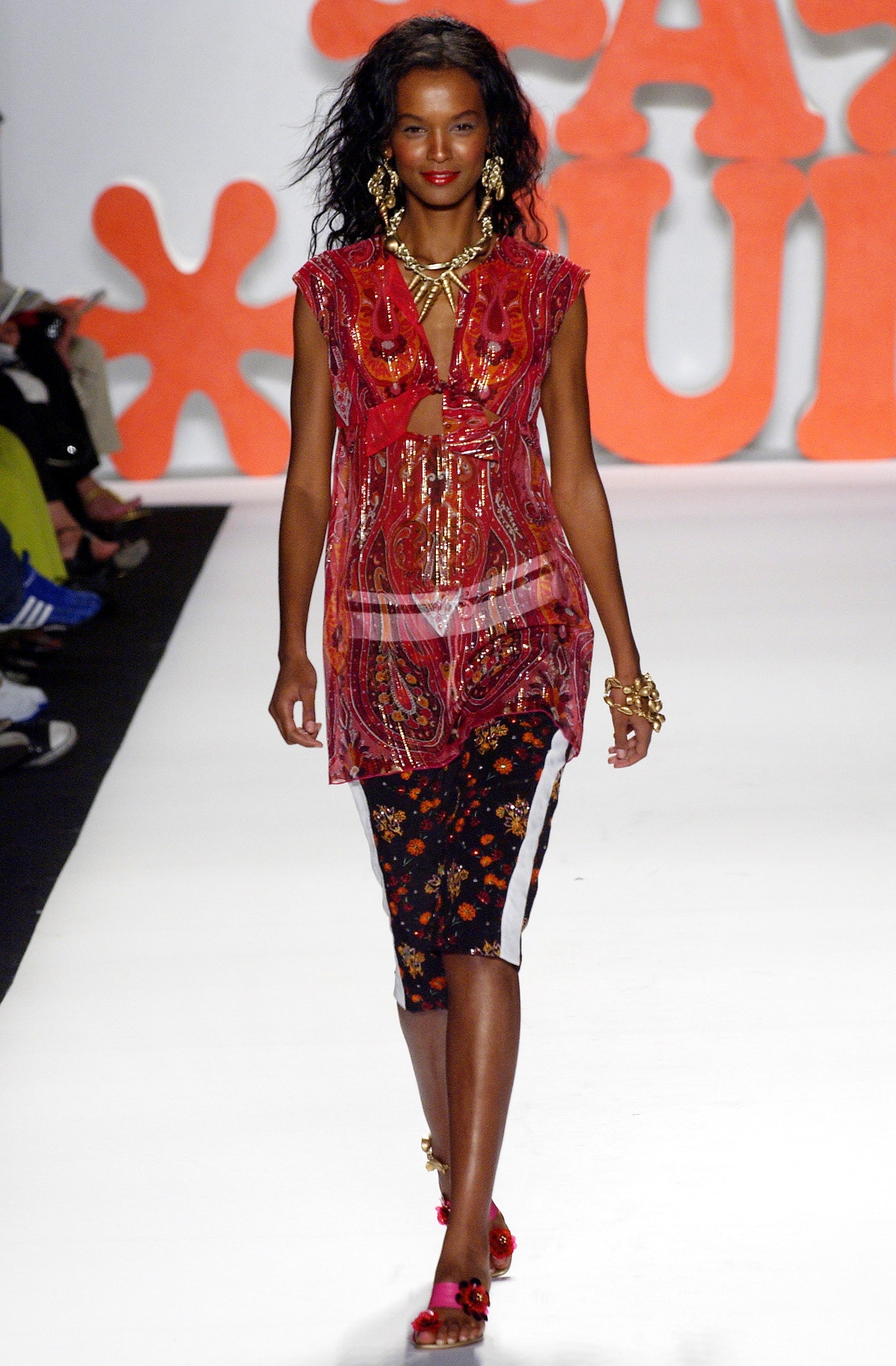 red embroidered sleeveless top and black pencil skirt