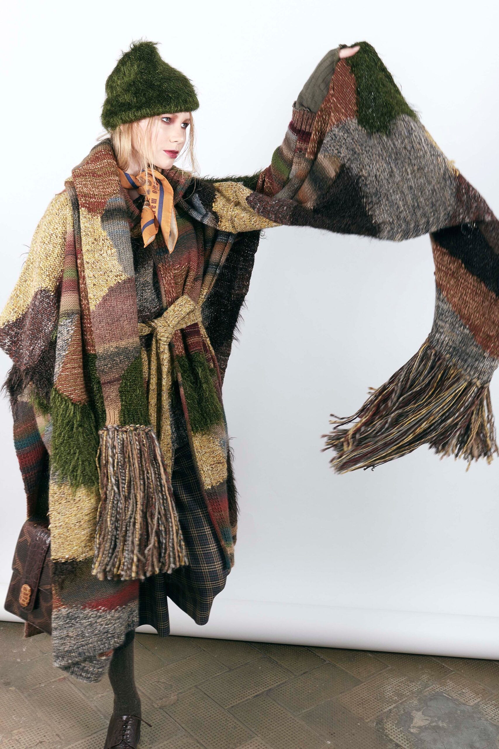 multi-colored oversized poncho with green hat