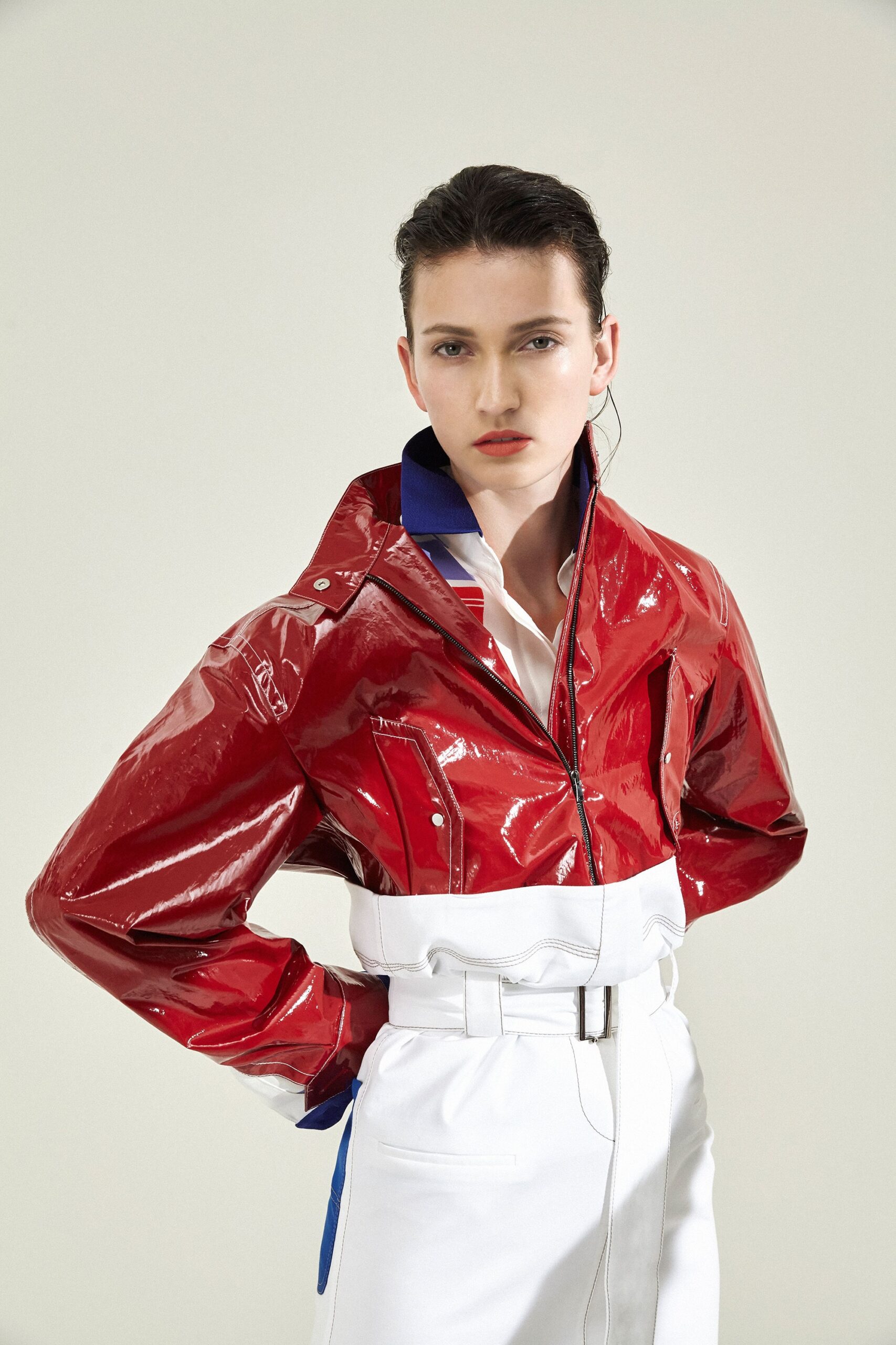 red vinyl fitted jacket with white shirt and pants