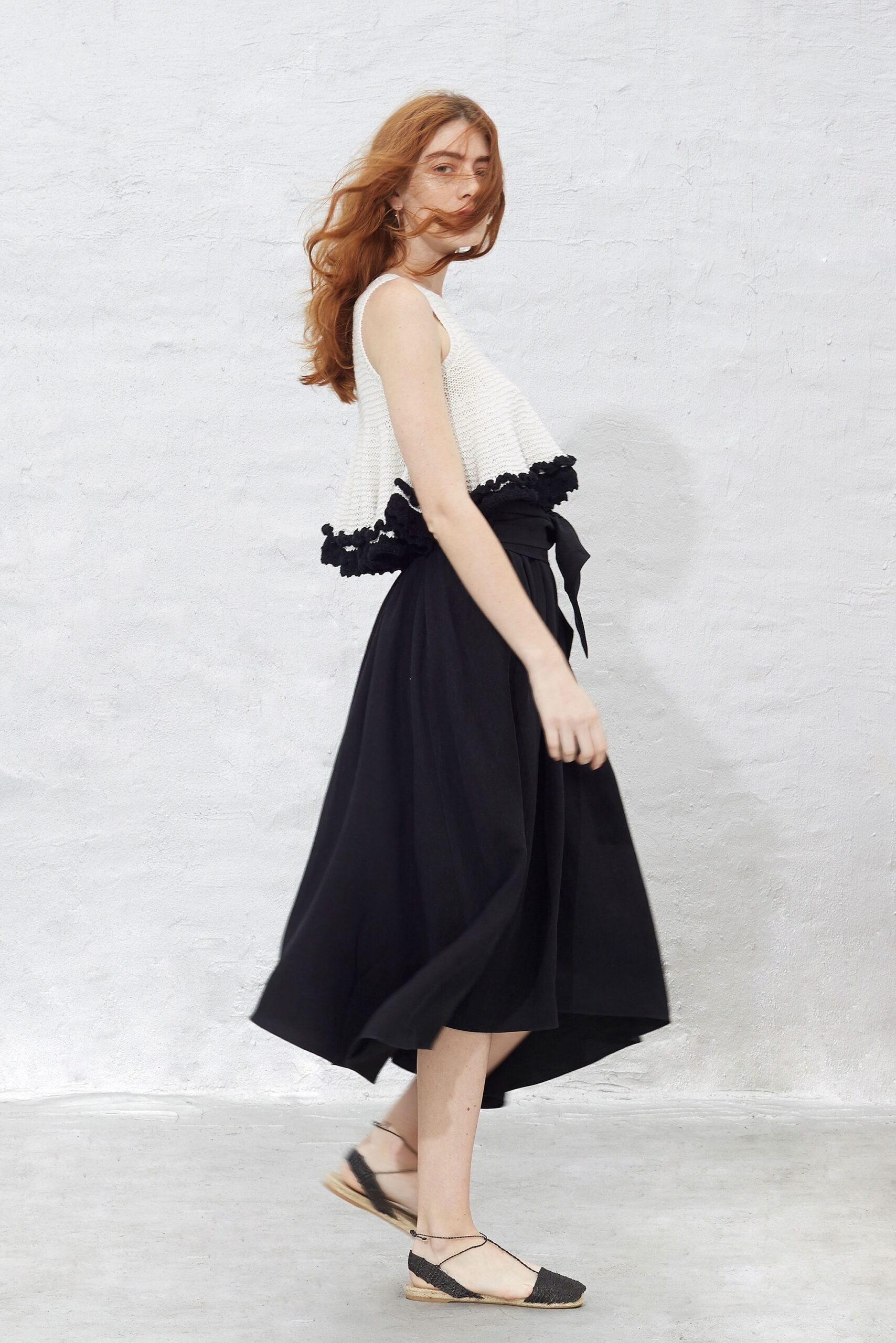 white fitted top with black skirt