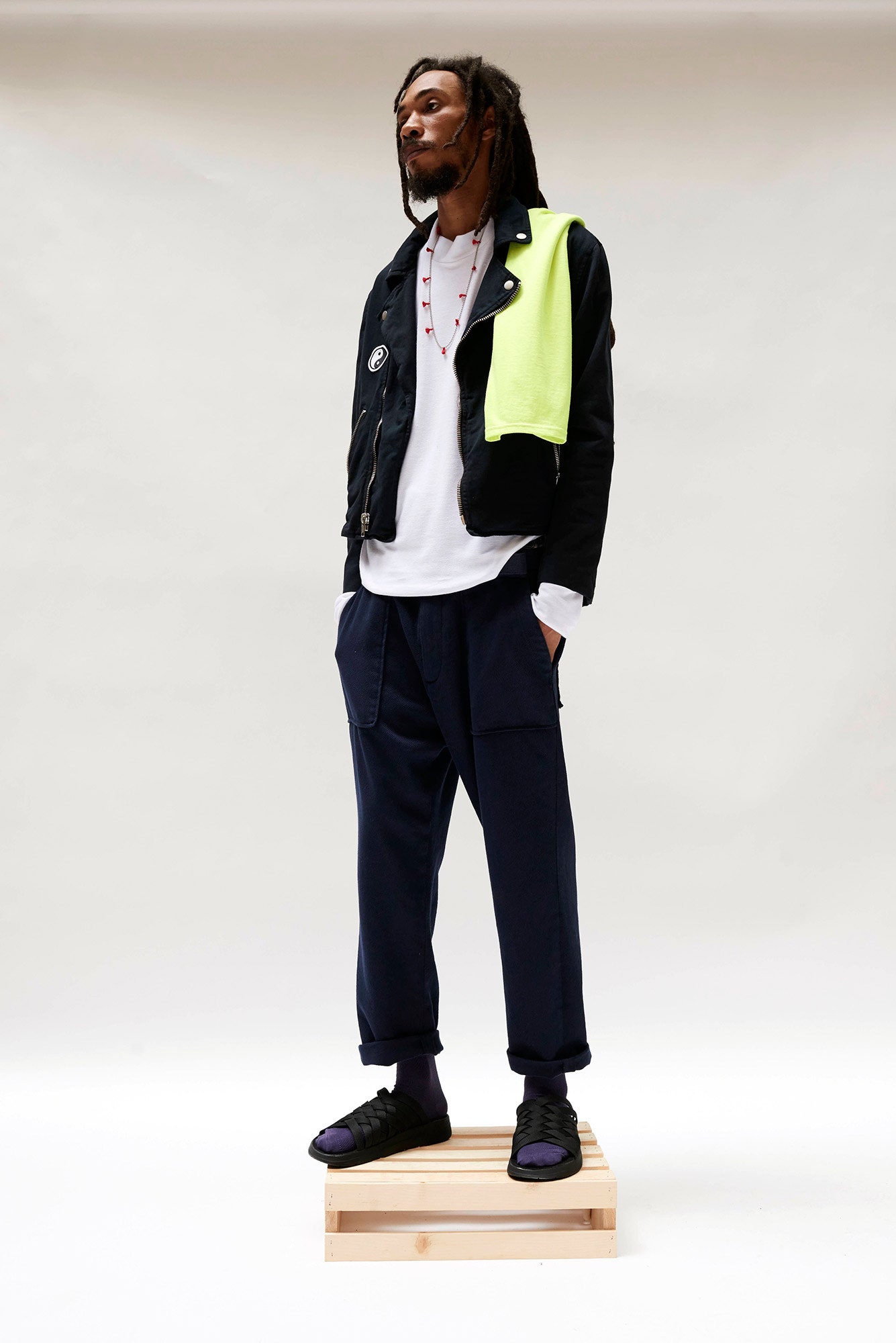 black jacket with neon green sweater