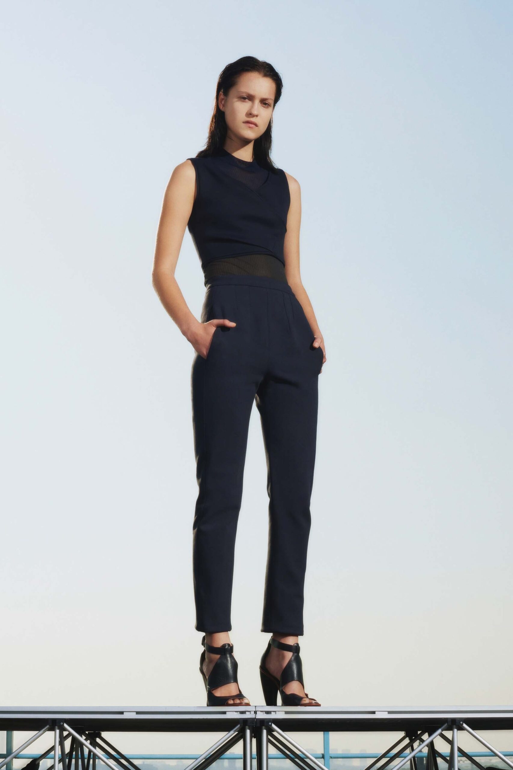 black fitted top and tailored pants