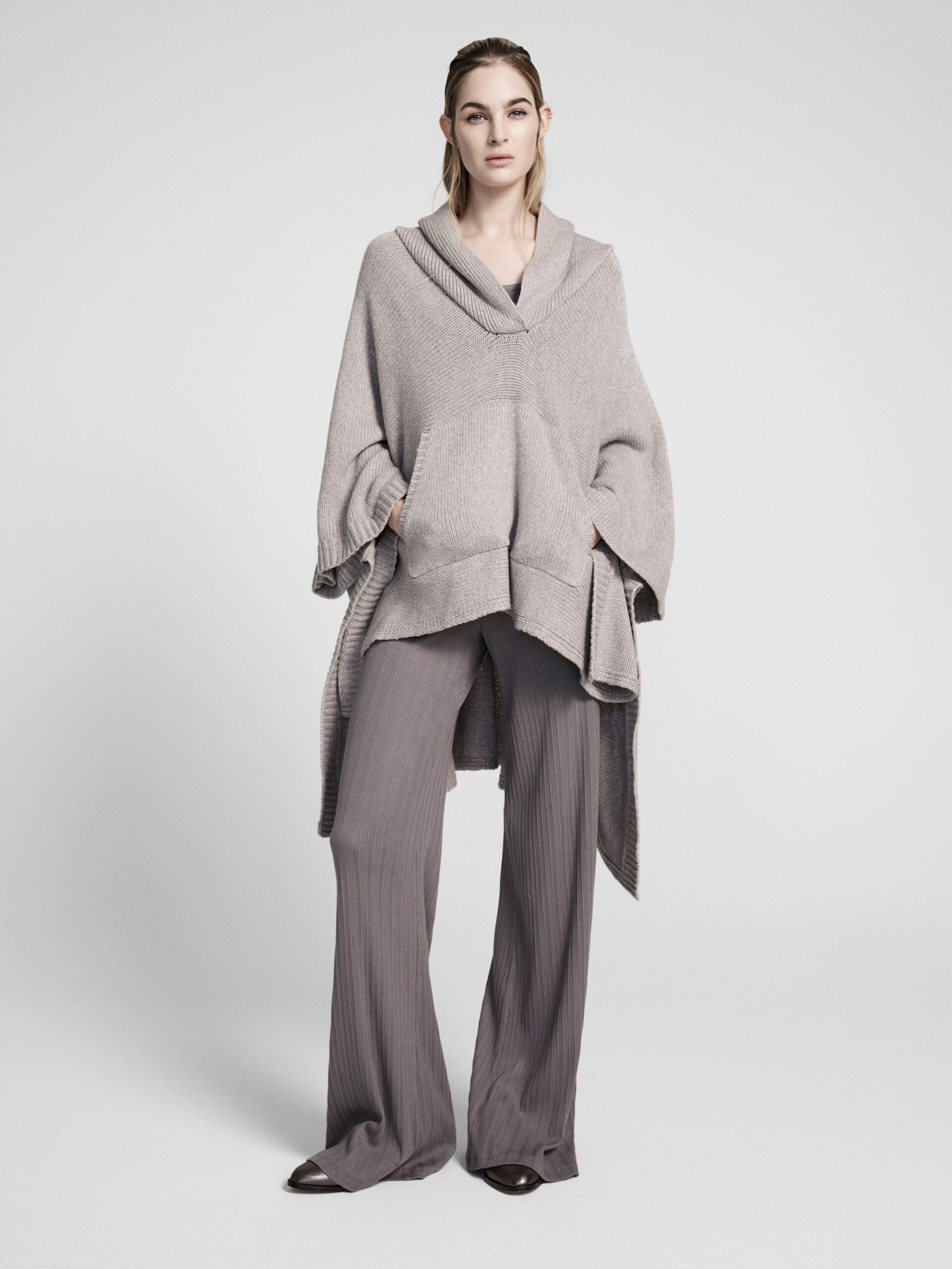 gray wool poncho and wide-leg pants