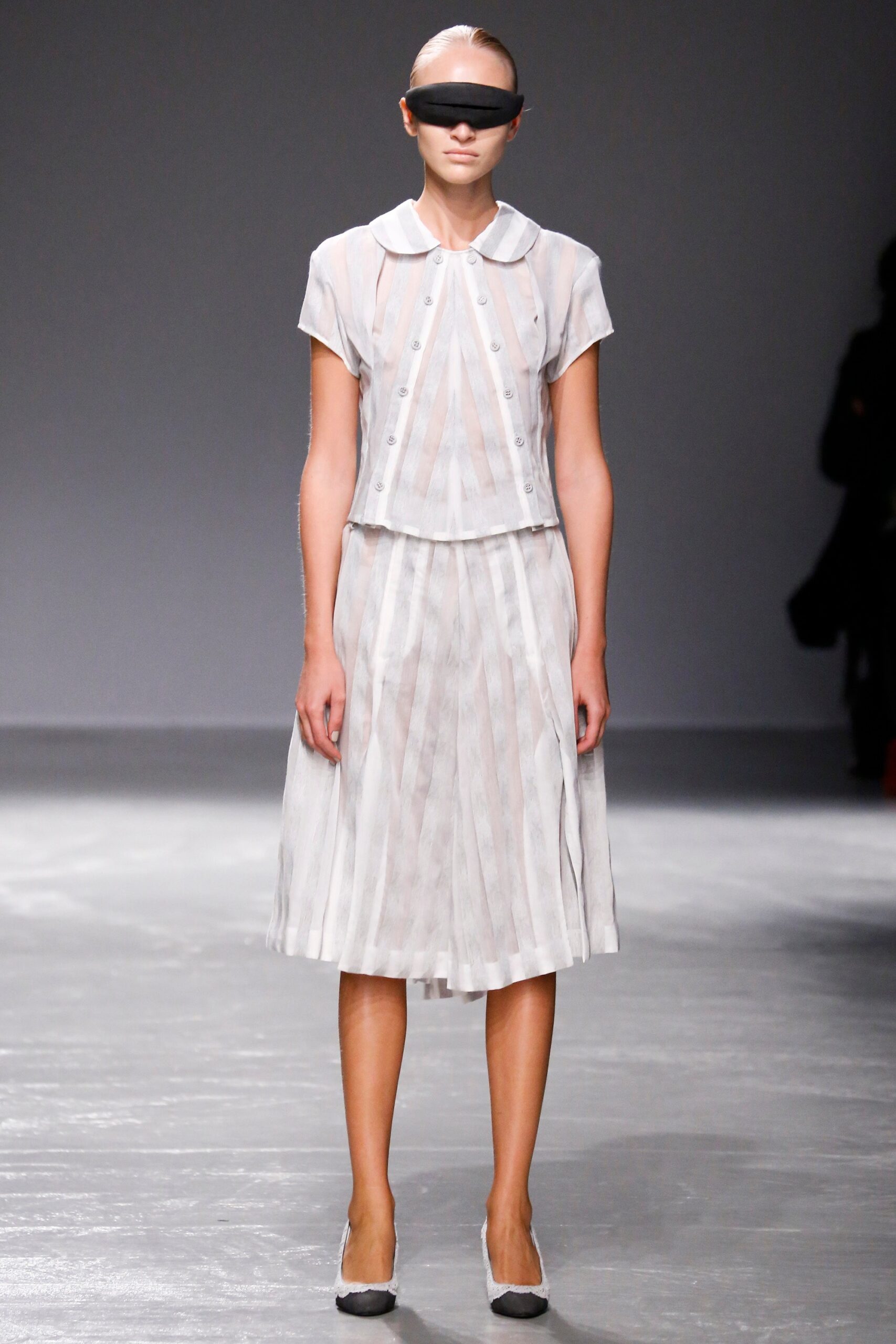 white pleated blouse and skirt