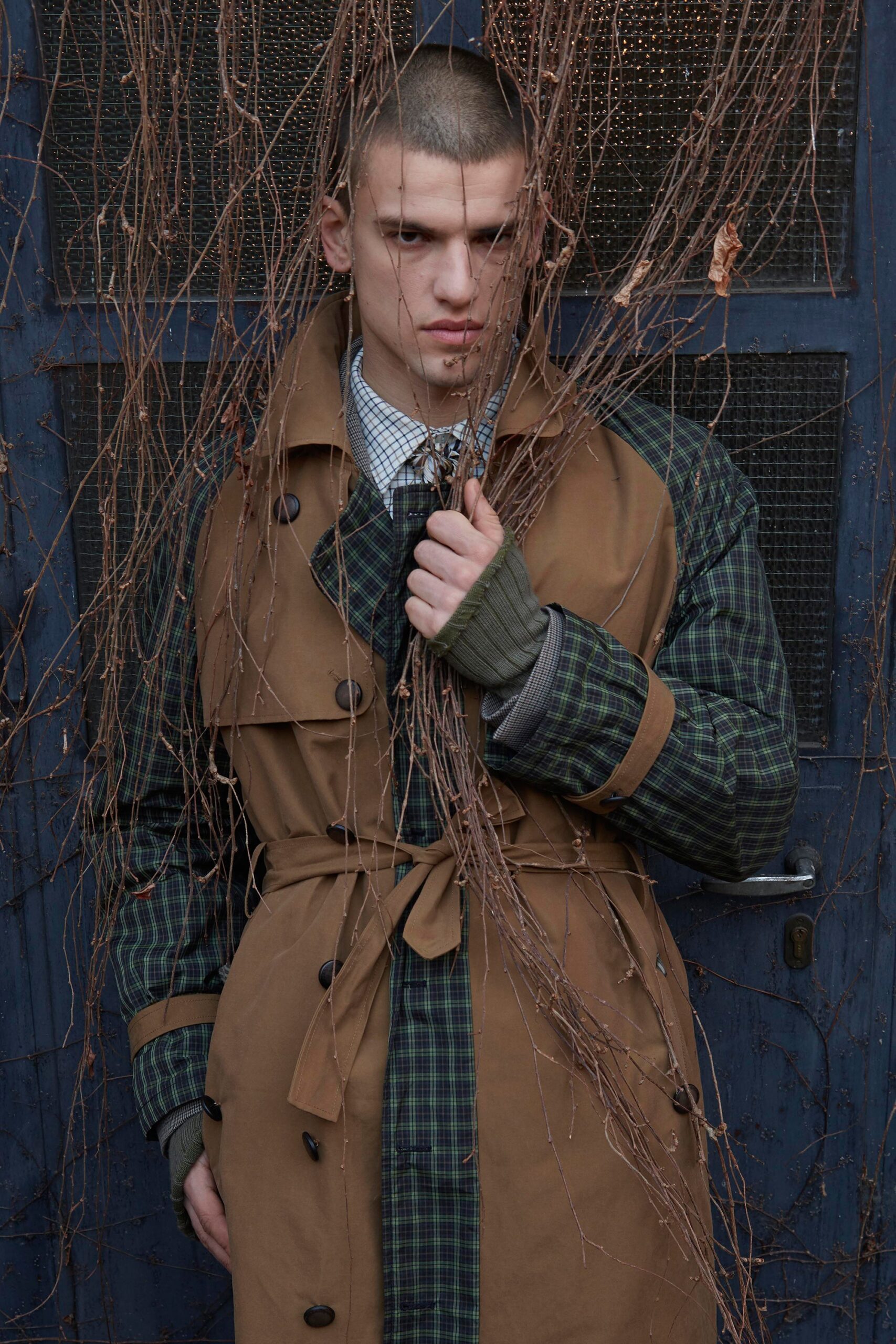 brown trench coat with green sweater