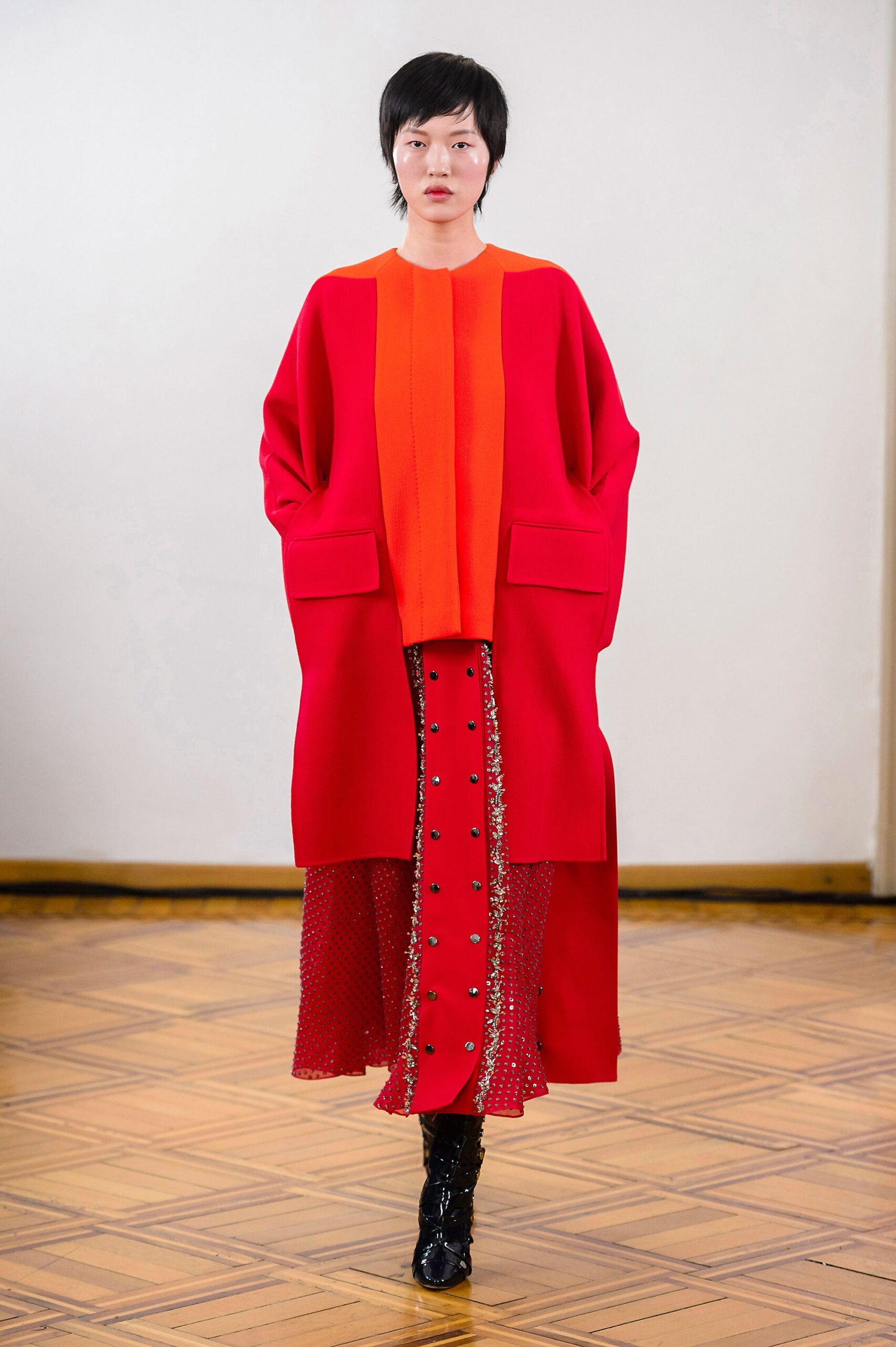 oversized red coat with fitted skirt