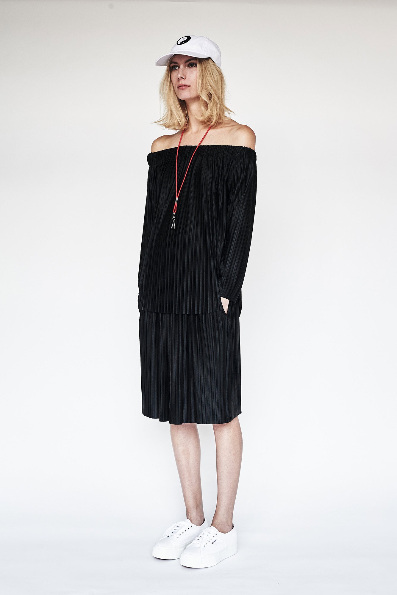 black pleated off-shoulder dress