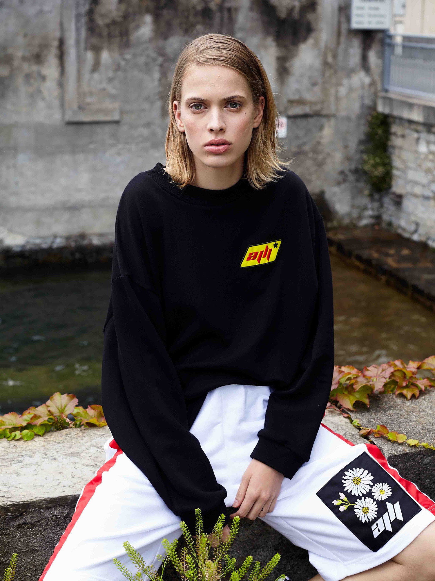 black oversized top and white shorts
