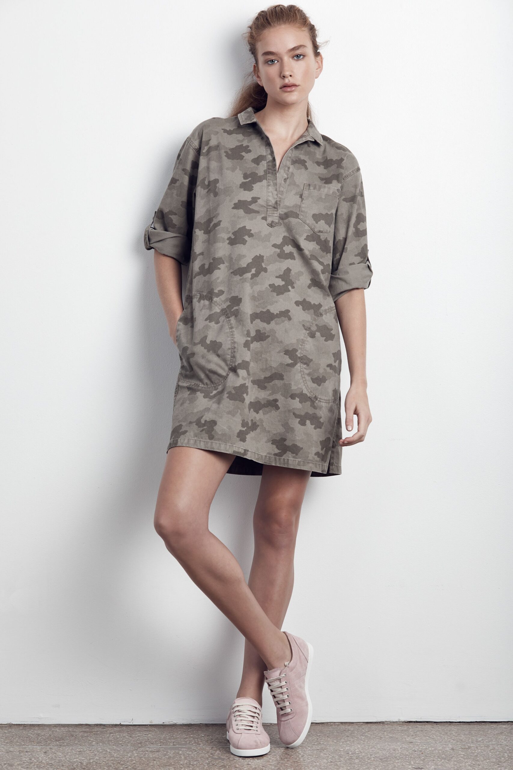 green camouflage shirt-dress with pink sneakers