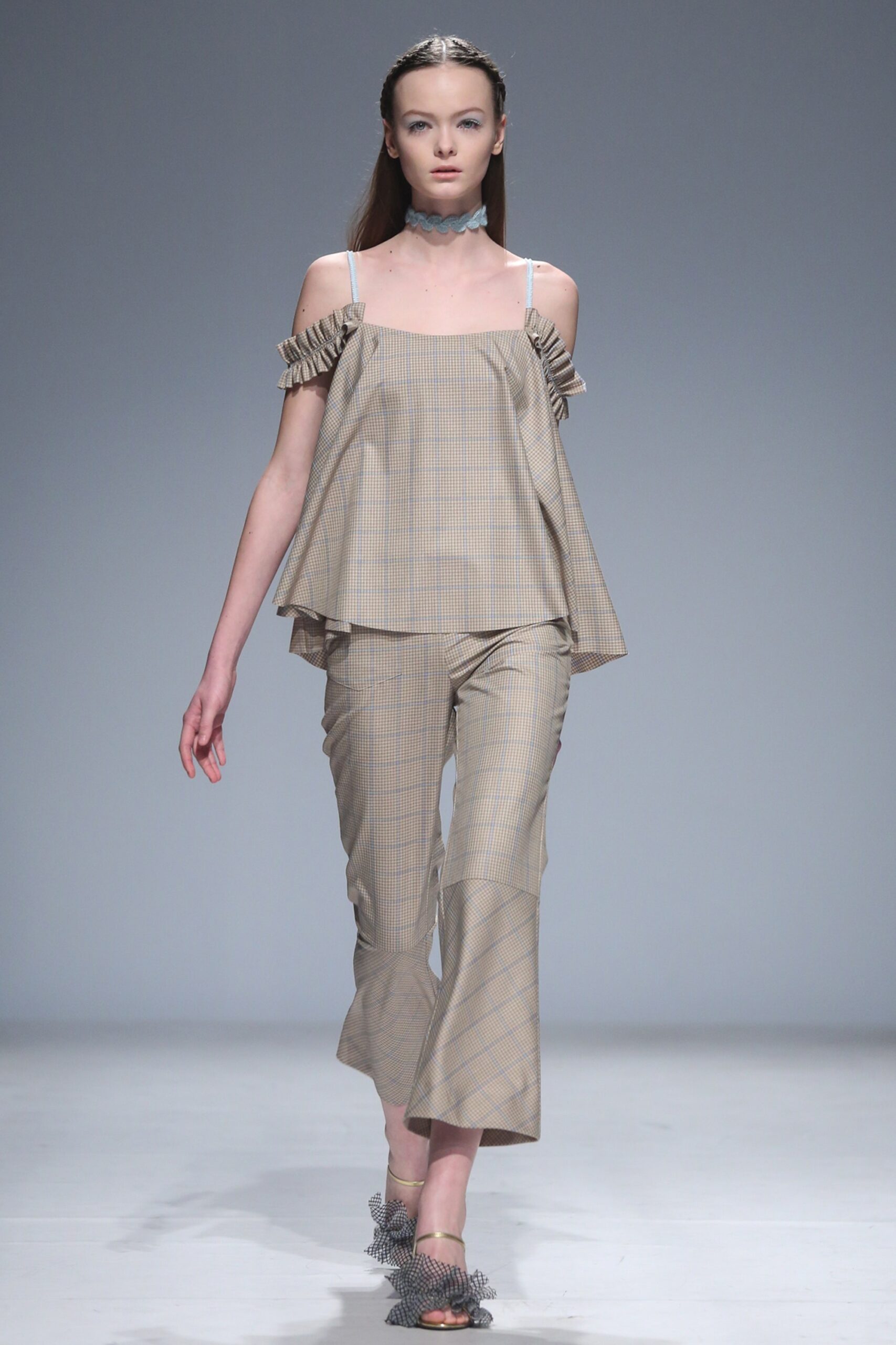 beige off-shoulder top with flared pants