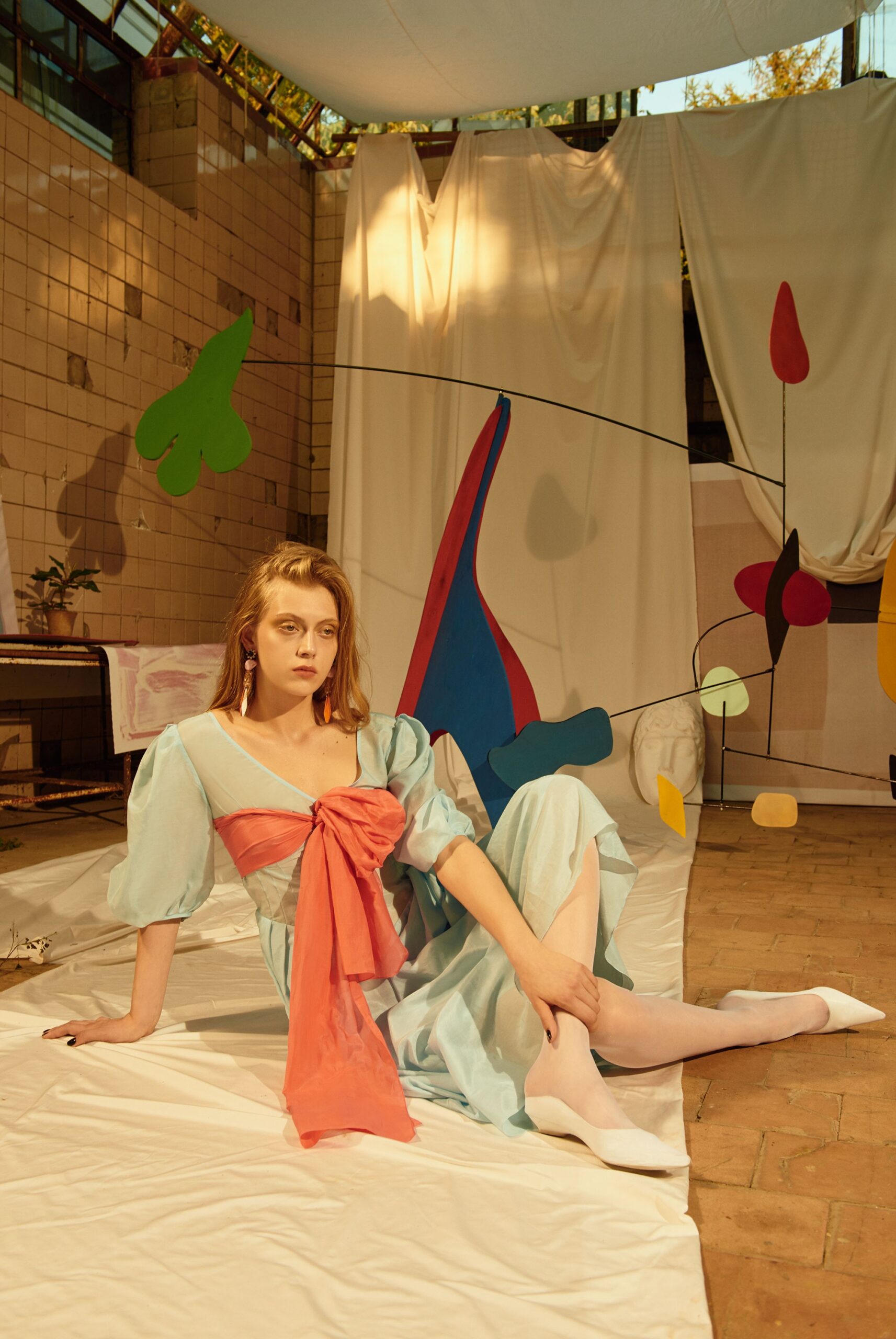 blue and coral draped midi dress