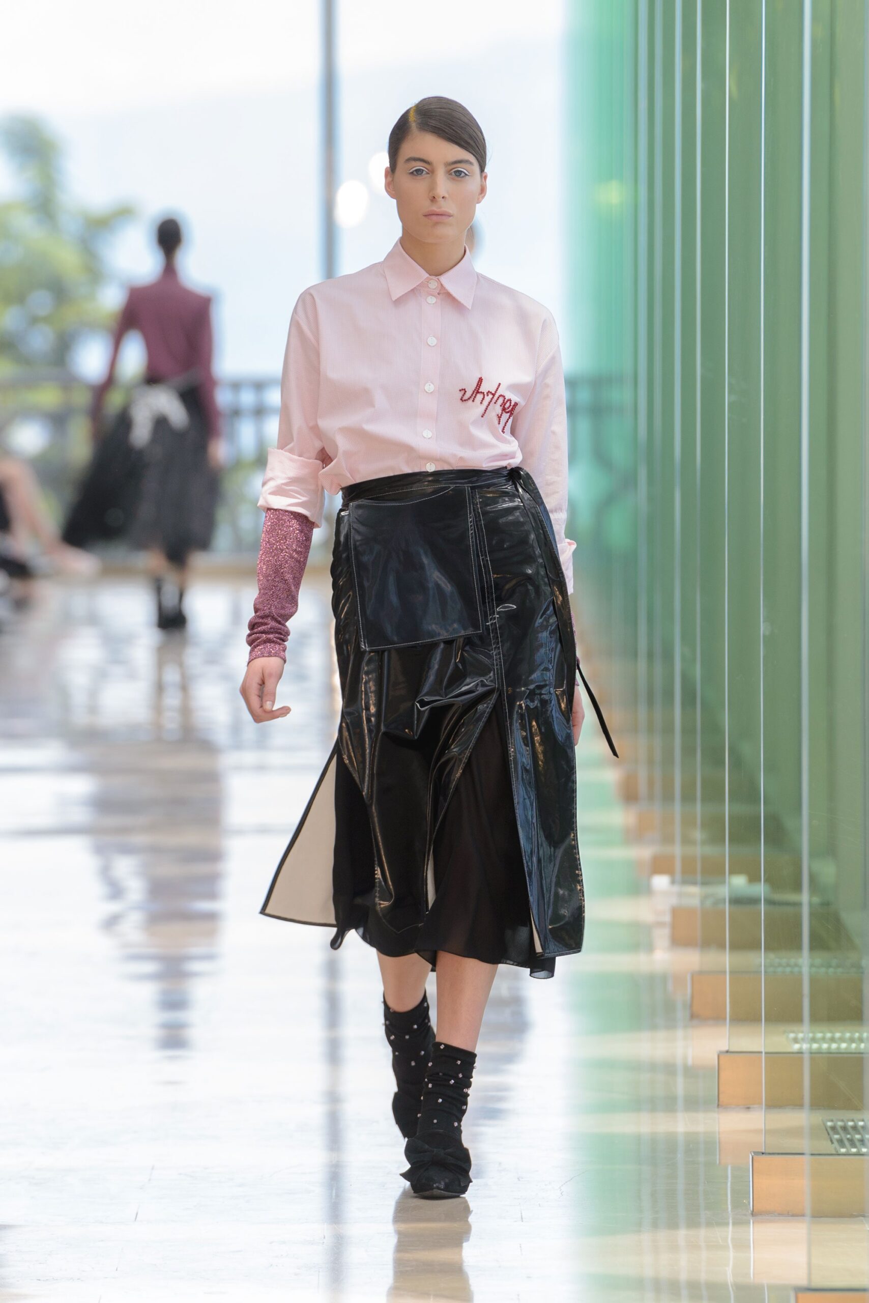 pink fitted shirt and black skirt