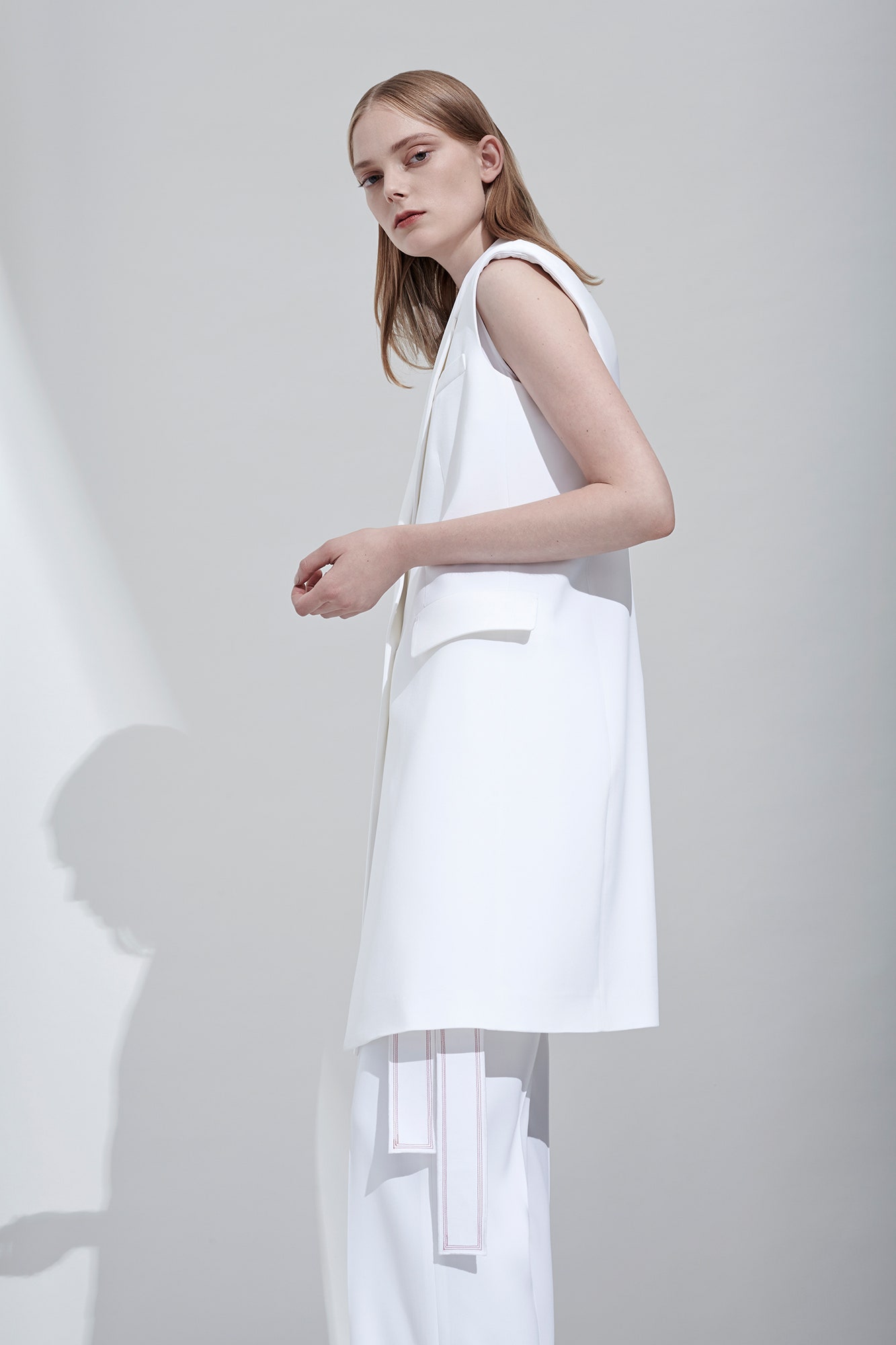 white fitted blazer and tailored pants