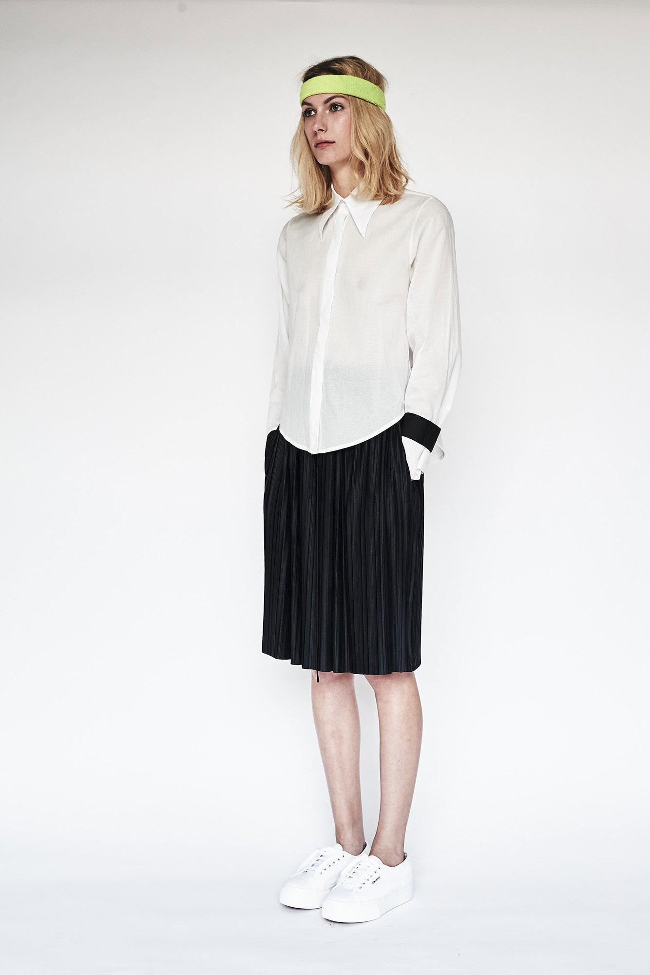 white shirt black pleated skirt