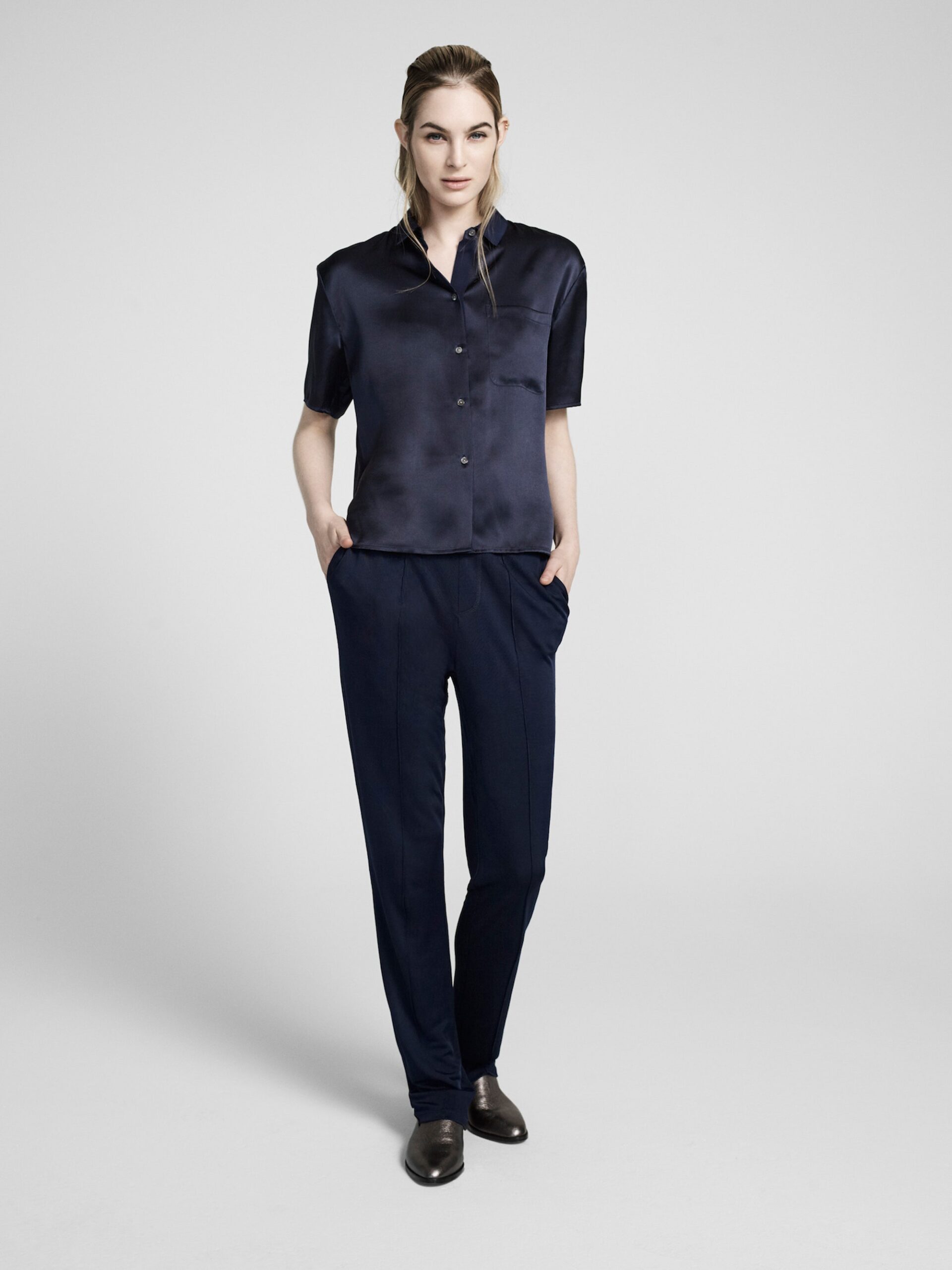 blue silk shirt and black pants
