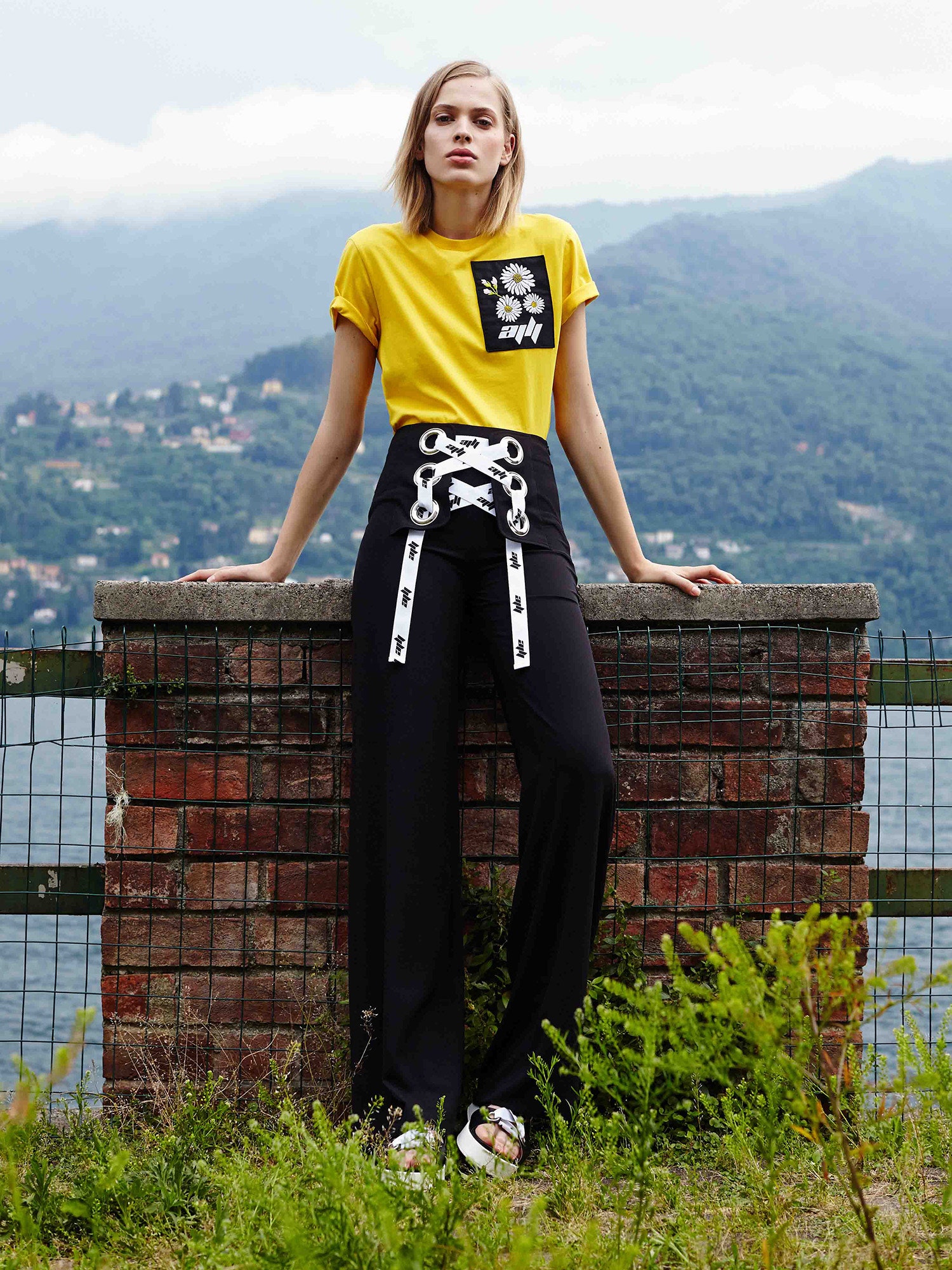 yellow printed top and black pants