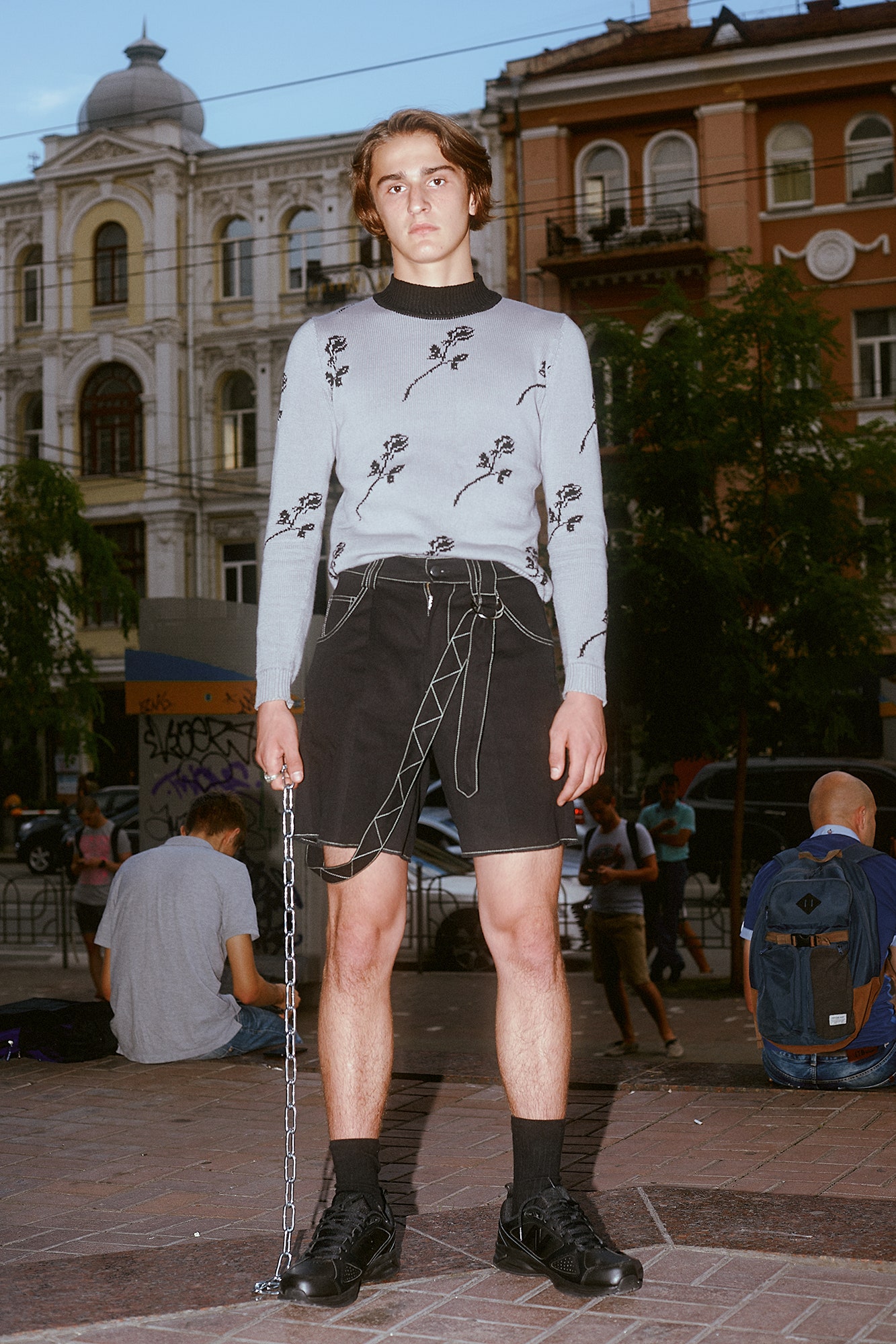 gray embroidered sweater and black shorts