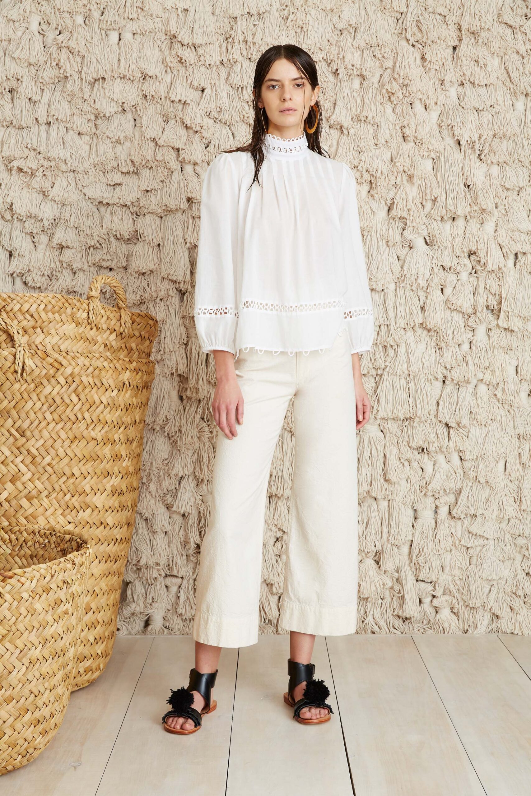 white embroidered blouse with beige pants