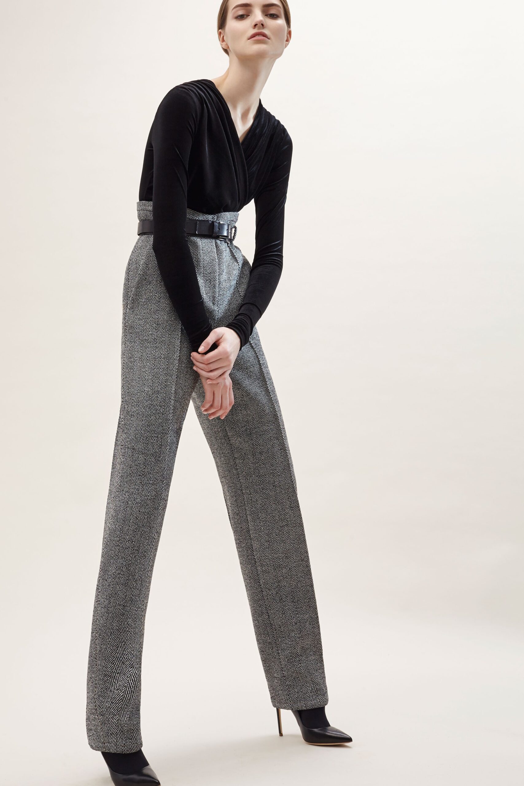 fitted black top and tailored gray pants