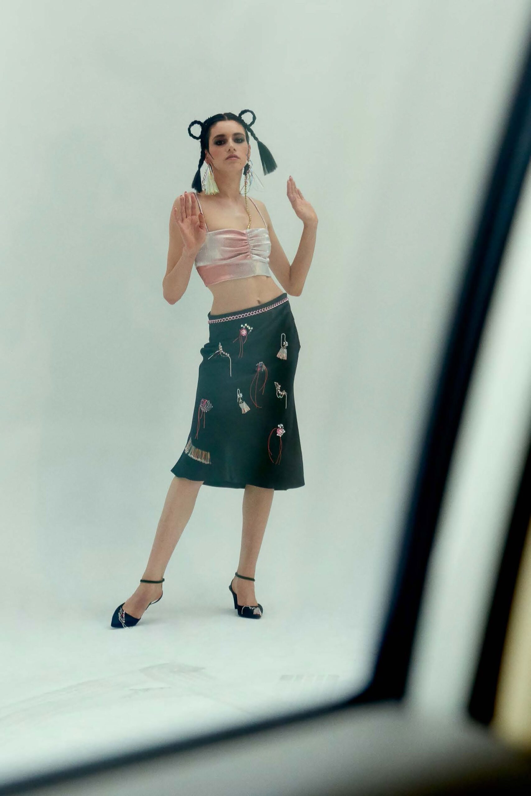 pink silk strapless top and black leather midi skirt