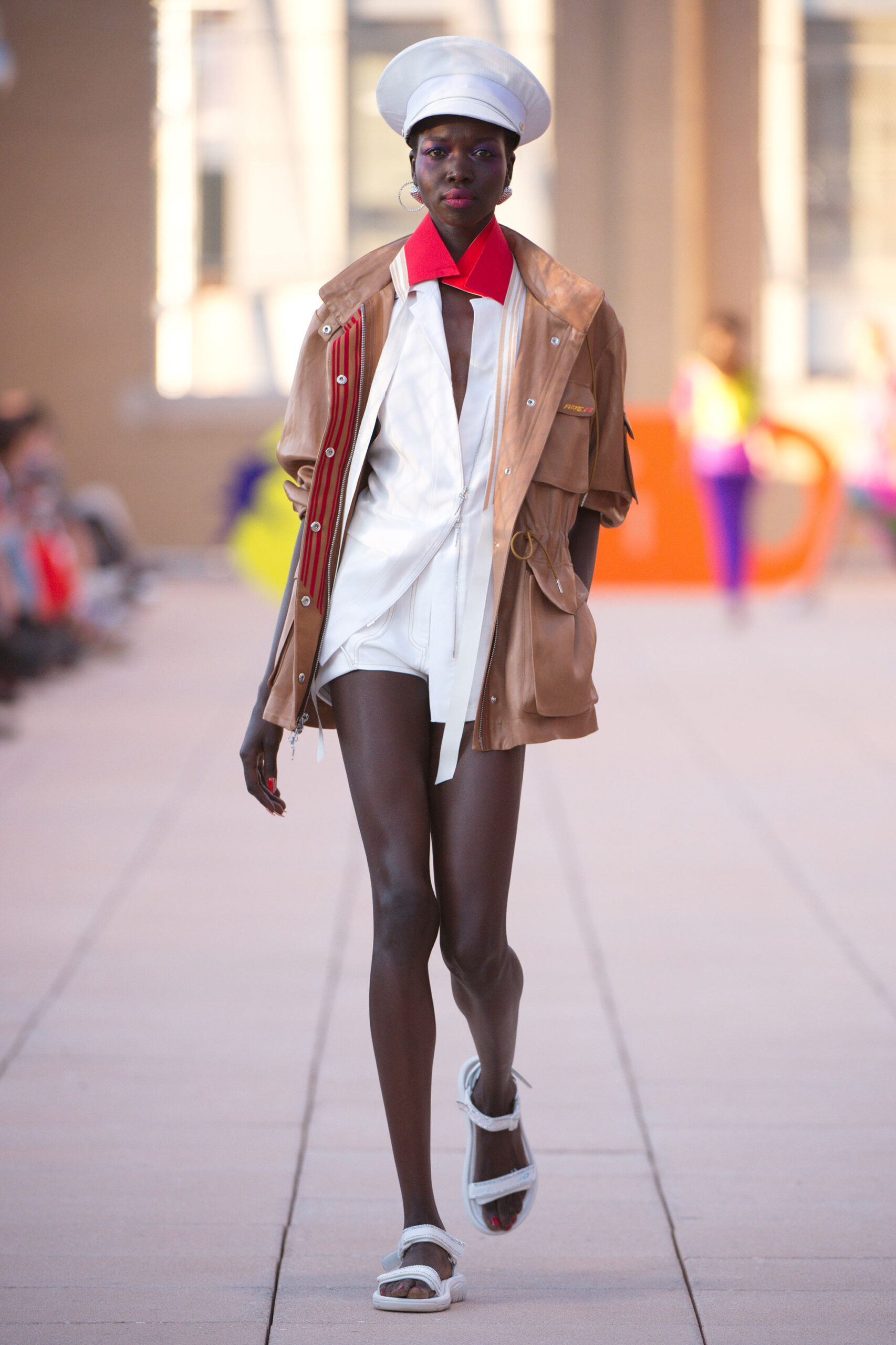 beige jacket with white shirt and shorts