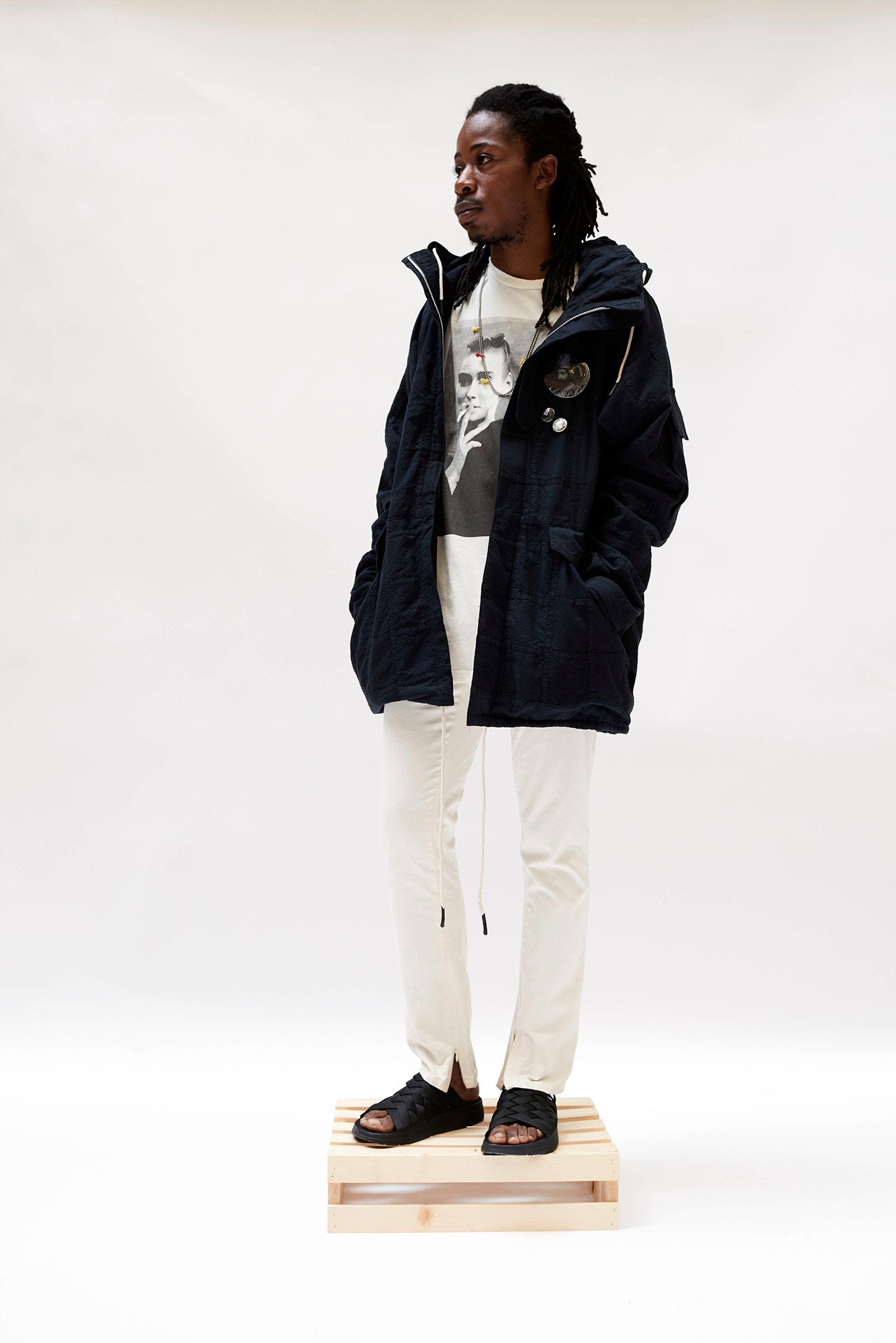 black jacket white t-shirt pants sandals