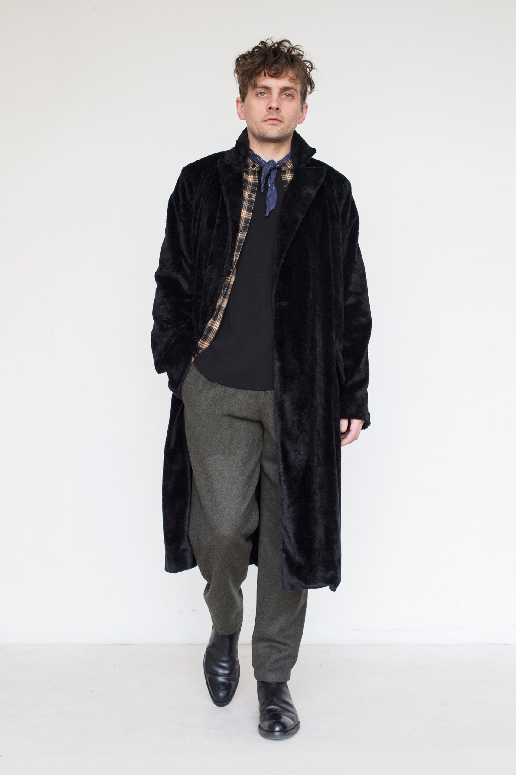 black faux-fur coat with checked shirt