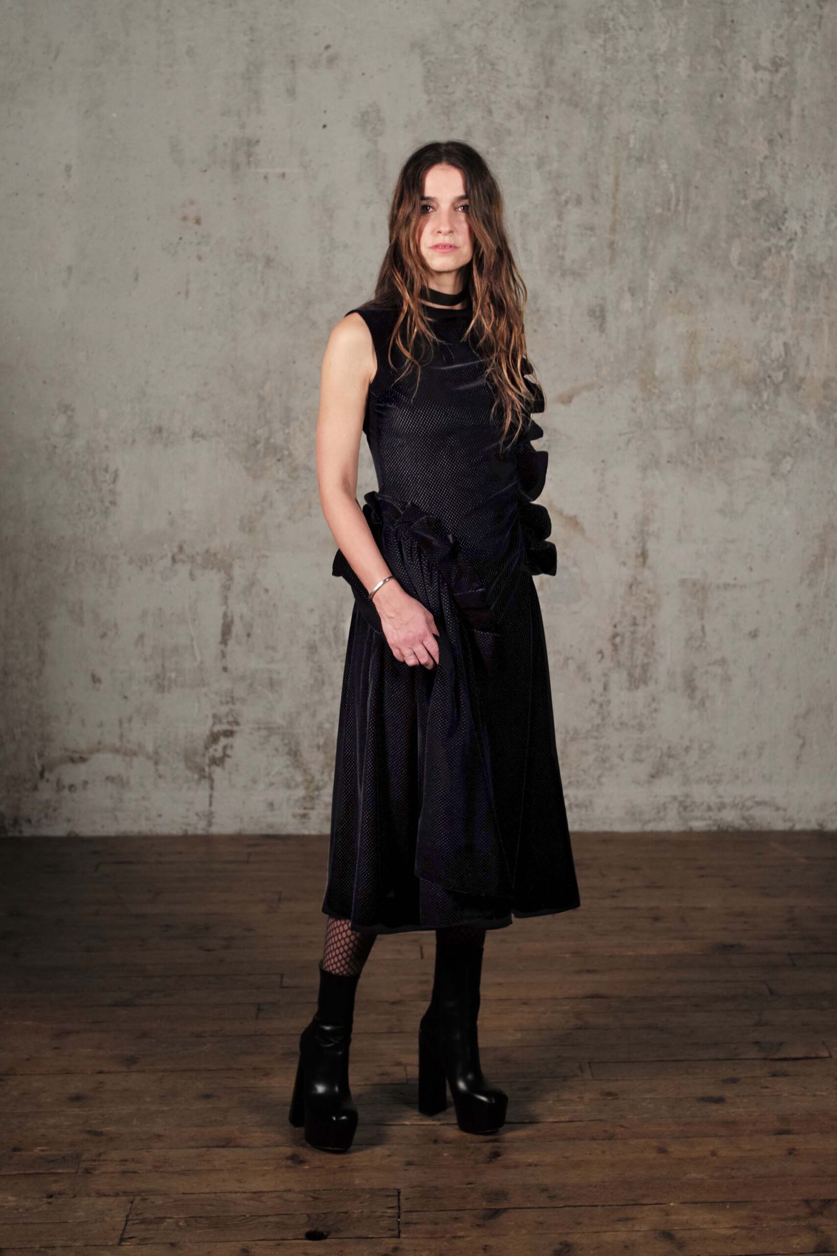 black fitted midi dress with boots