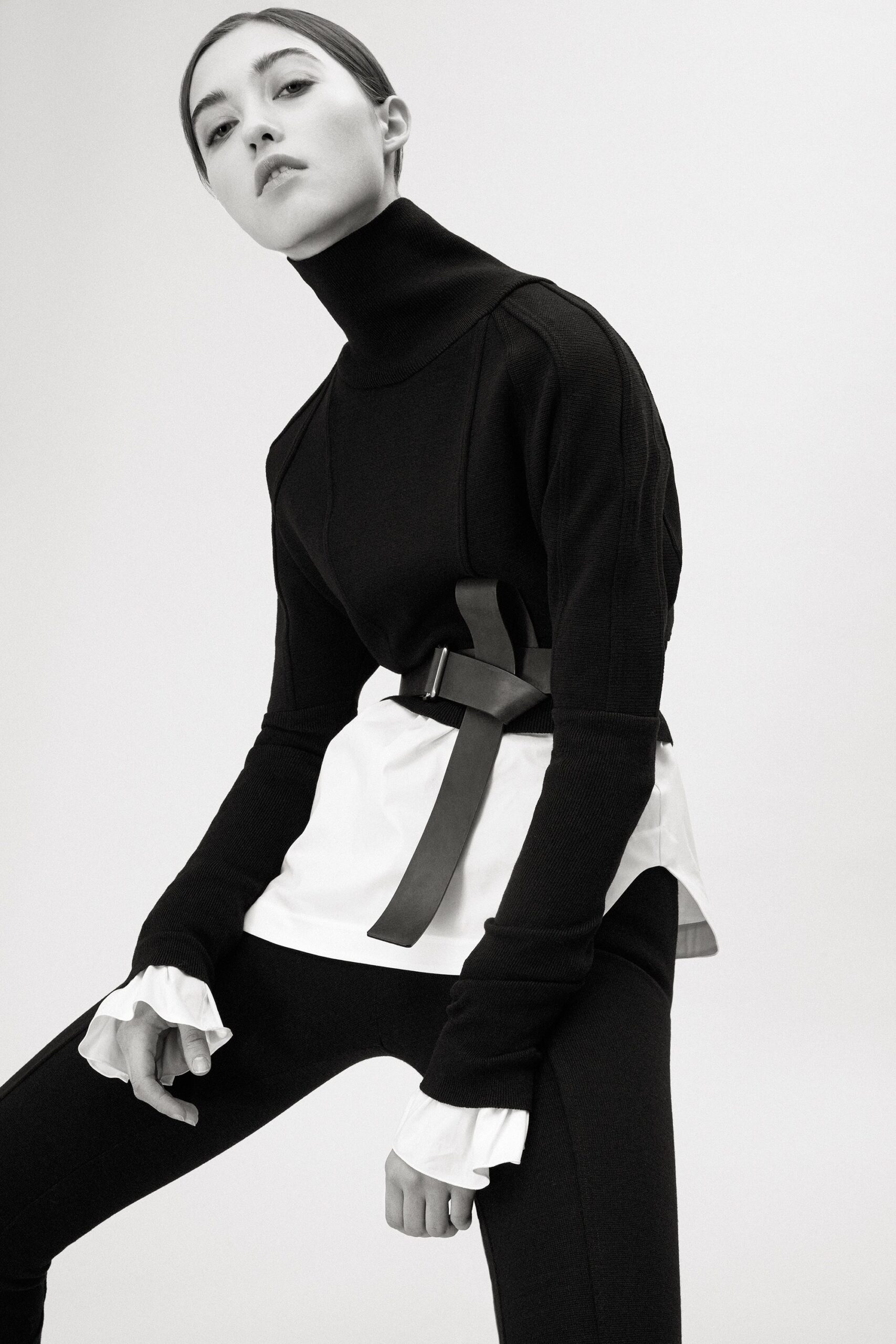 black fitted top with white blouse