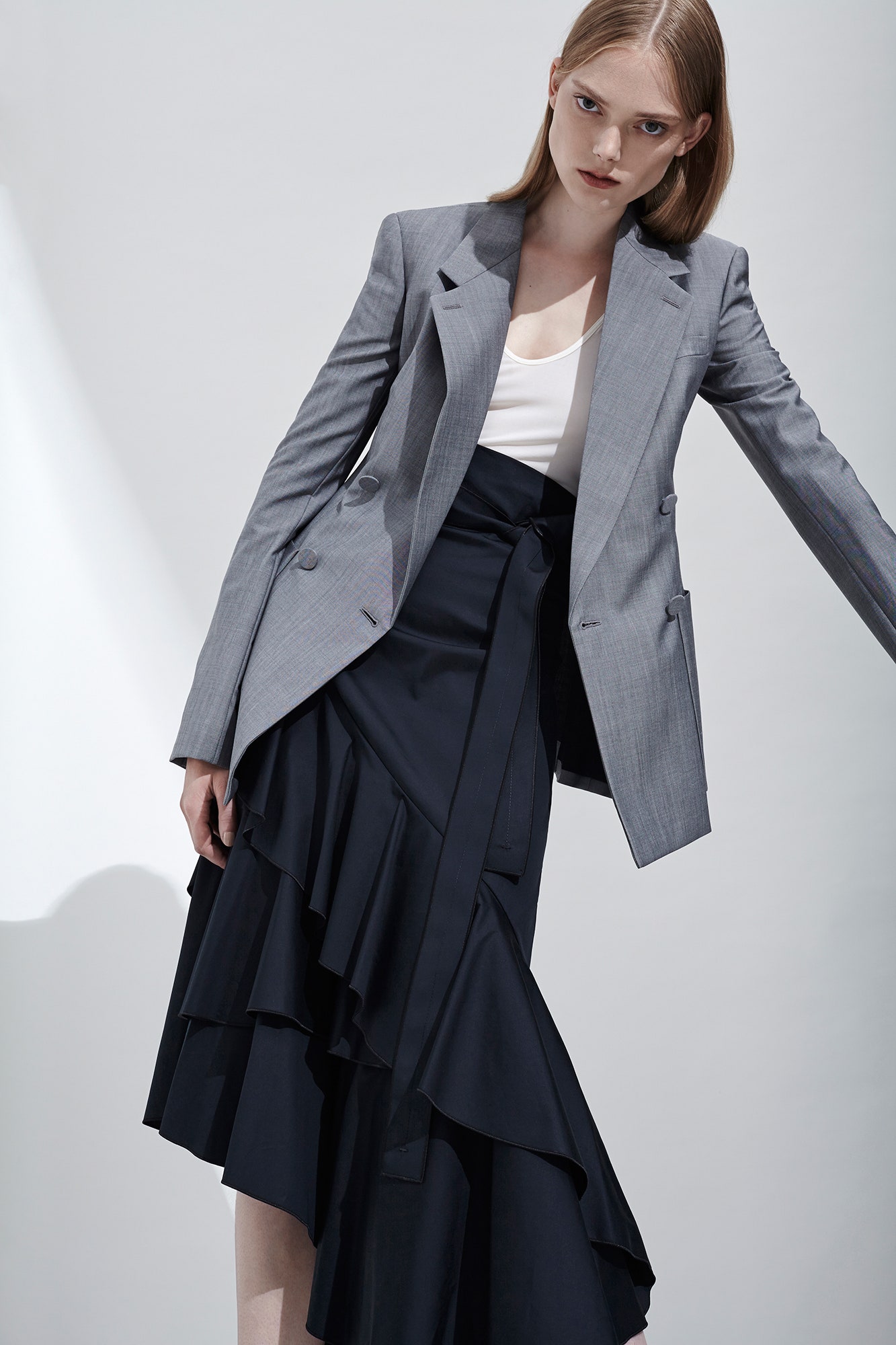 gray tailored blazer with black tiered skirt