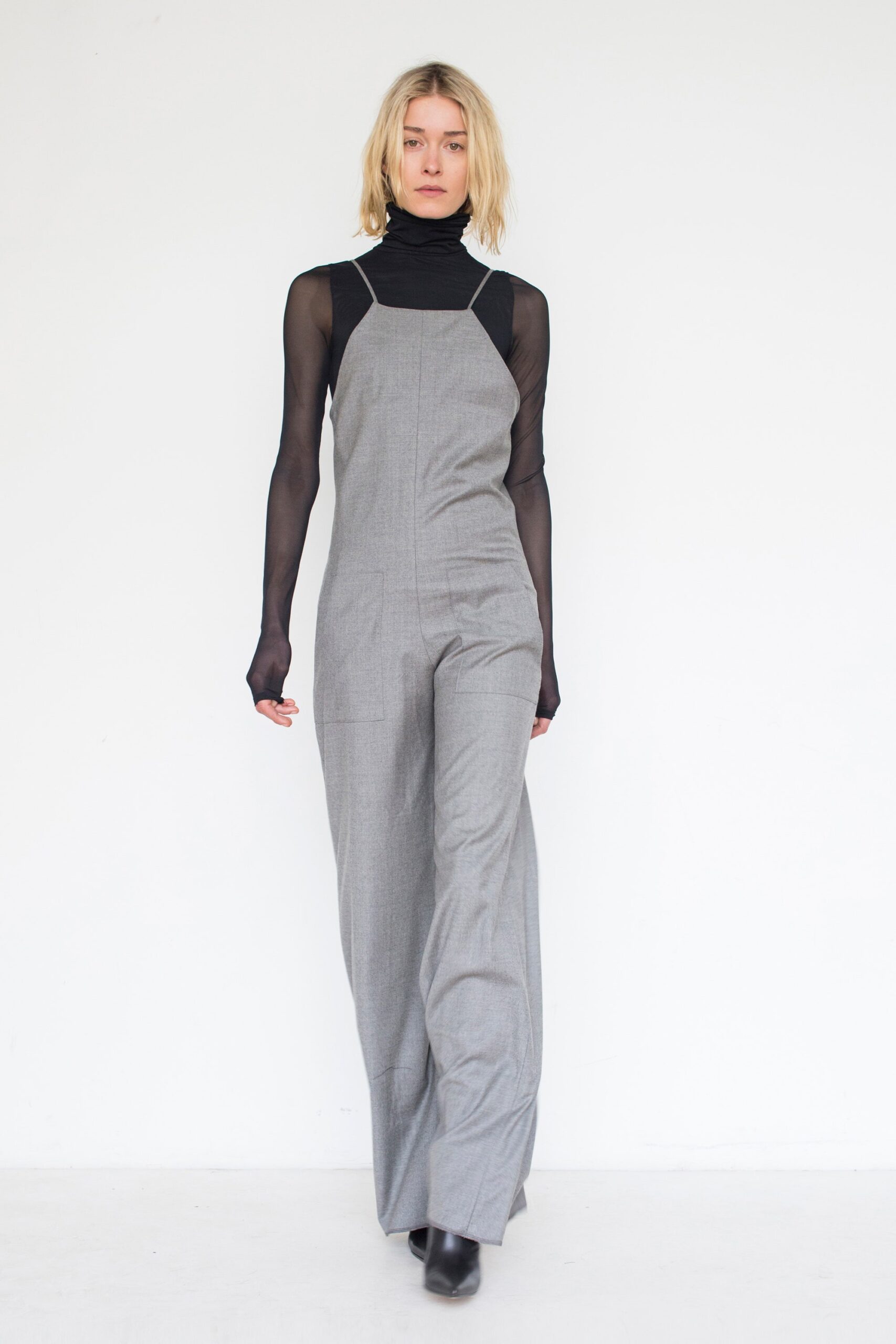 gray fitted jumpsuit with black top