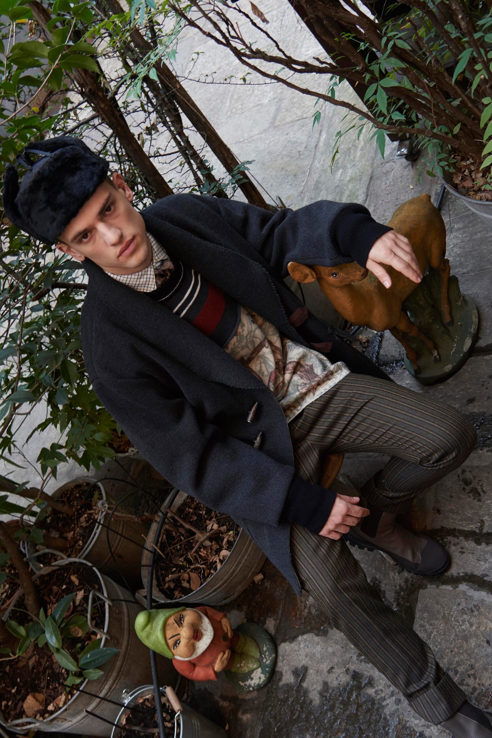 black wool coat with red sweater