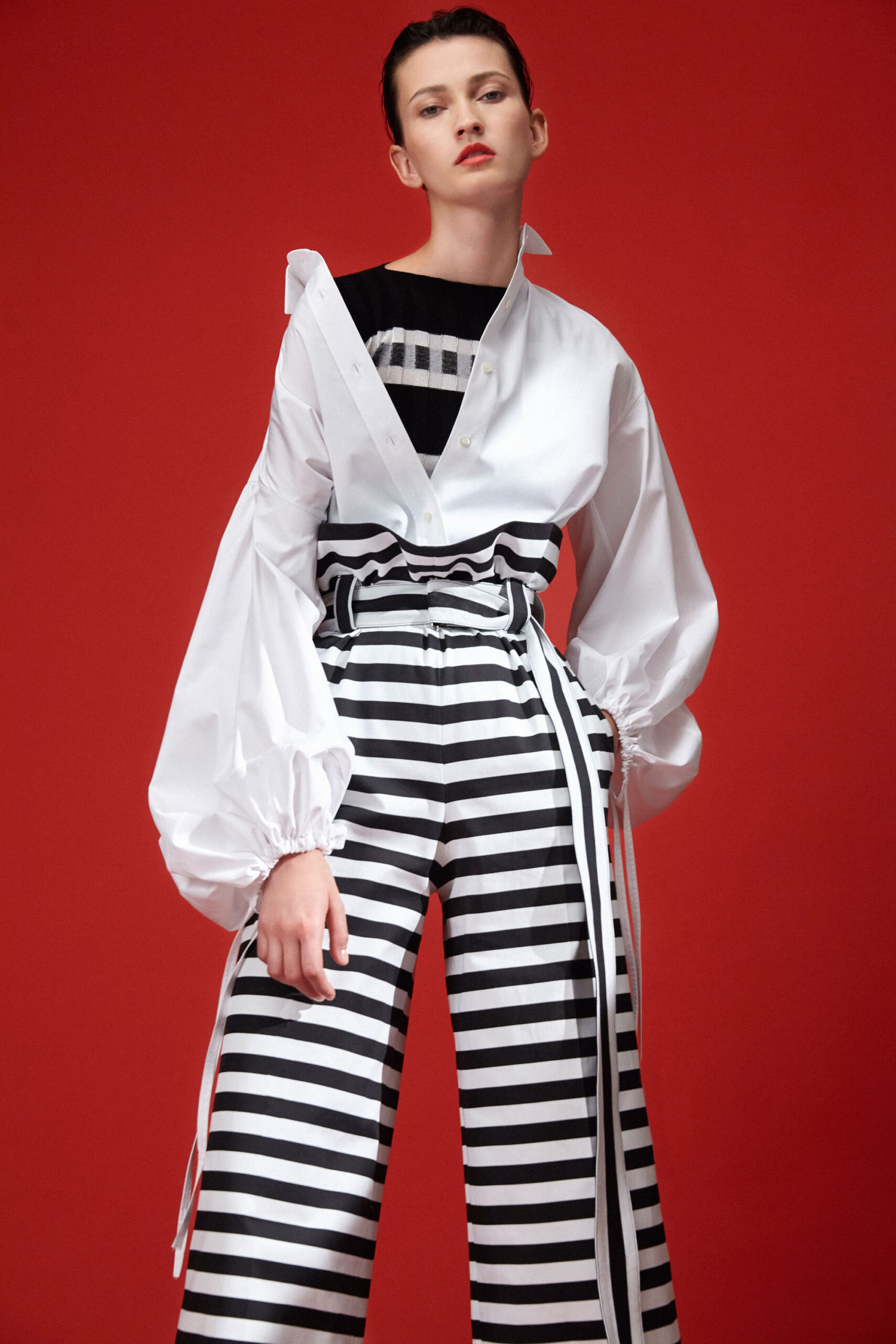 white relaxed shirt with striped pants