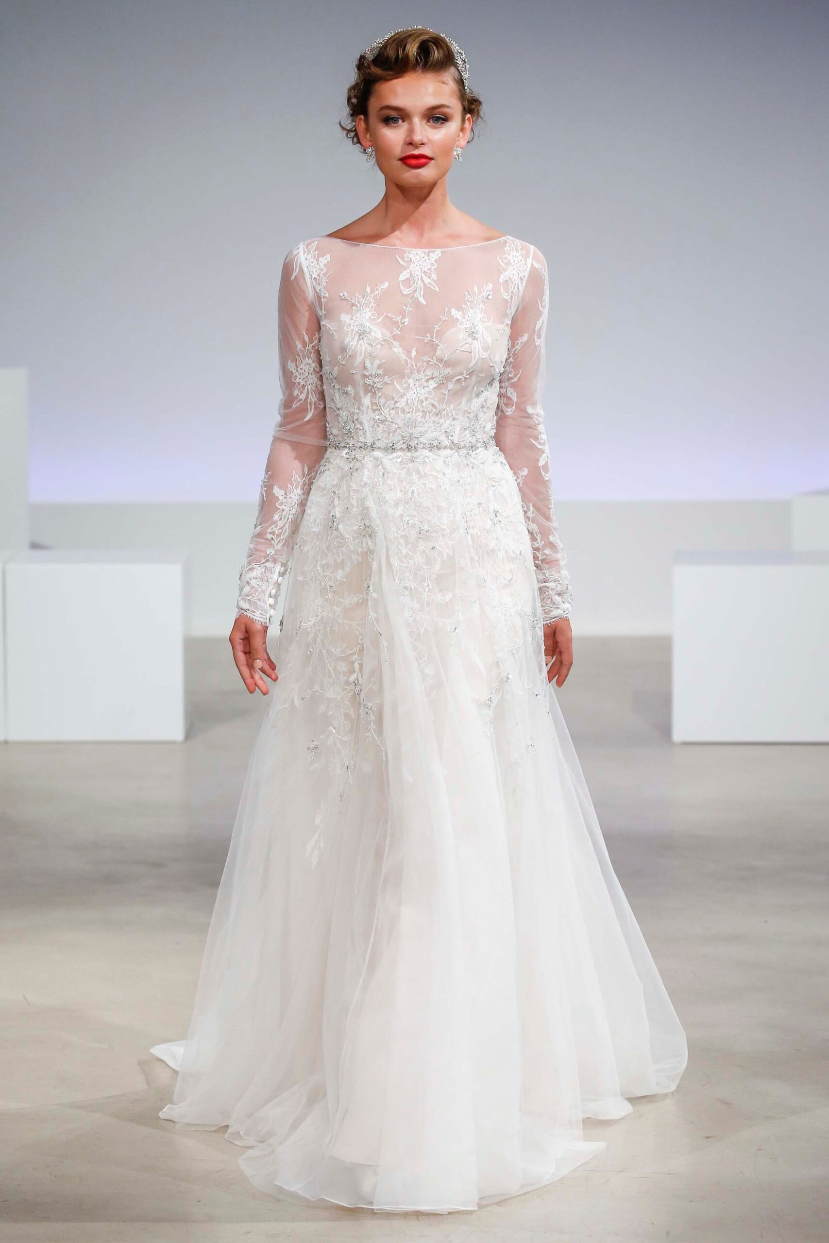 white embroidered long-sleeve gown