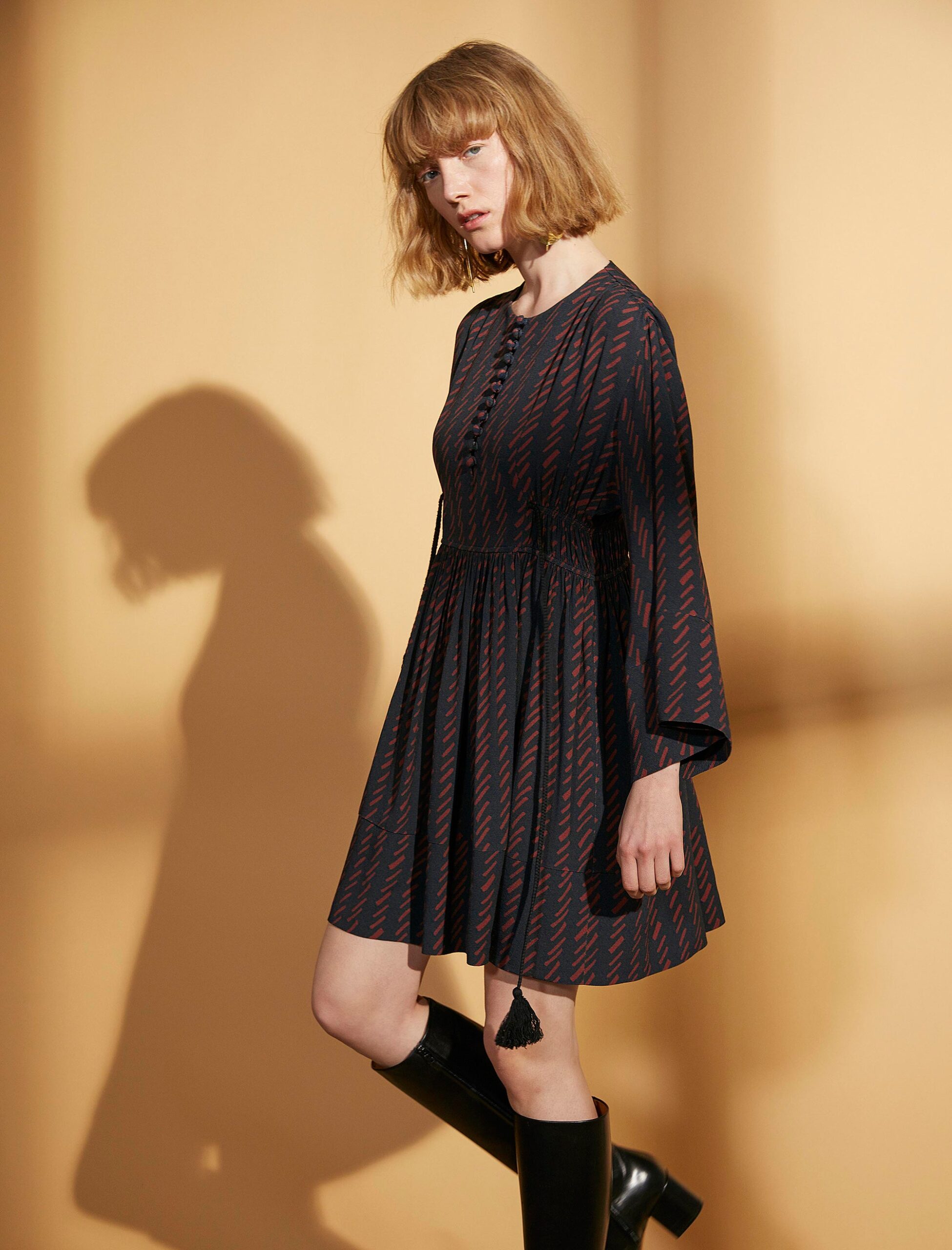 black cotton long-sleeve collared fitted printed tiered dress