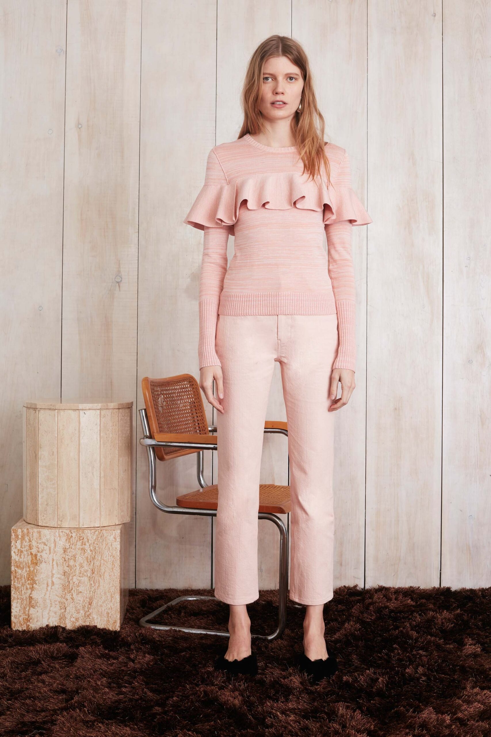 pink ruffled top with fitted pants