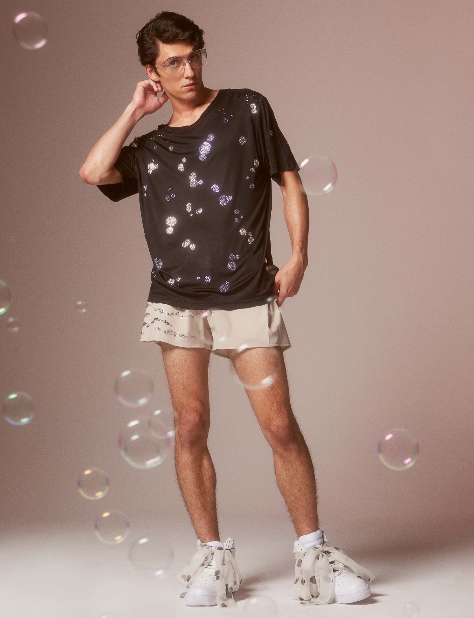 black relaxed t-shirt with beige shorts