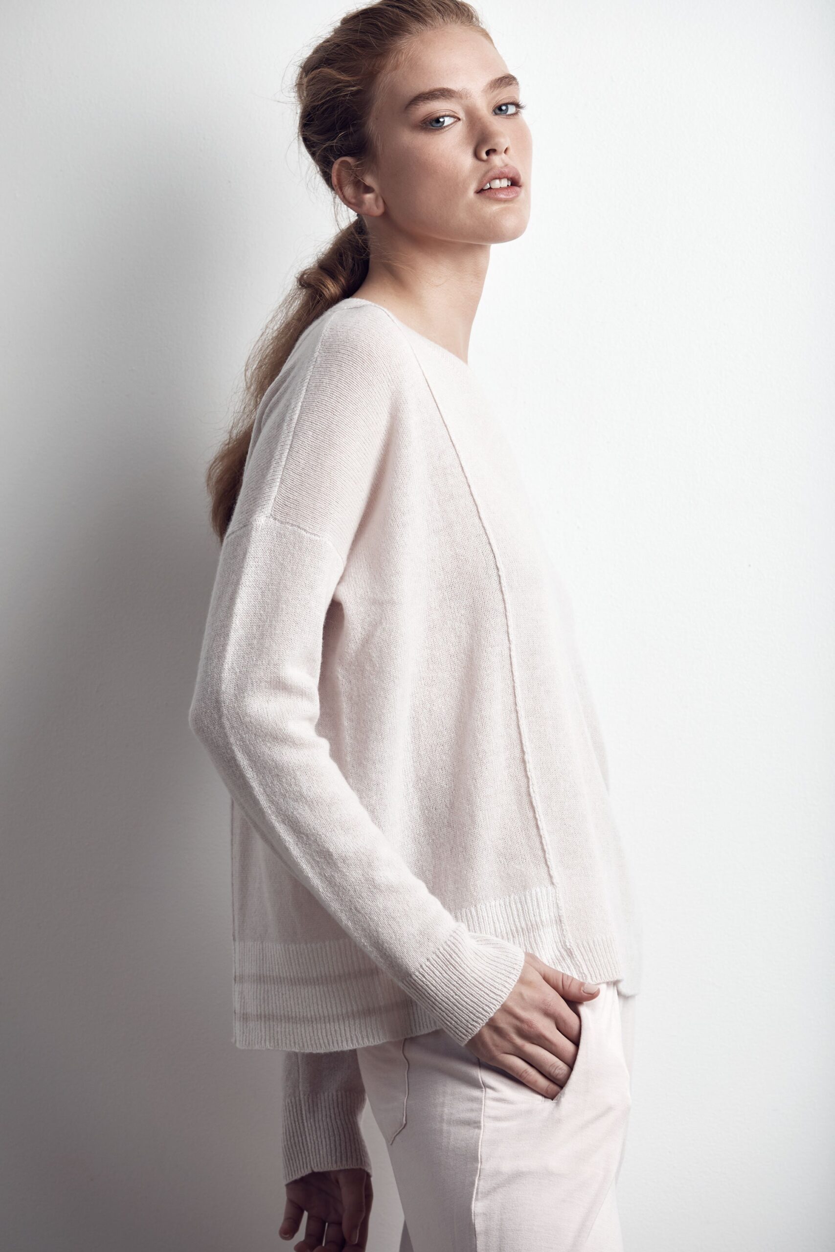 pink relaxed sweater with white pants