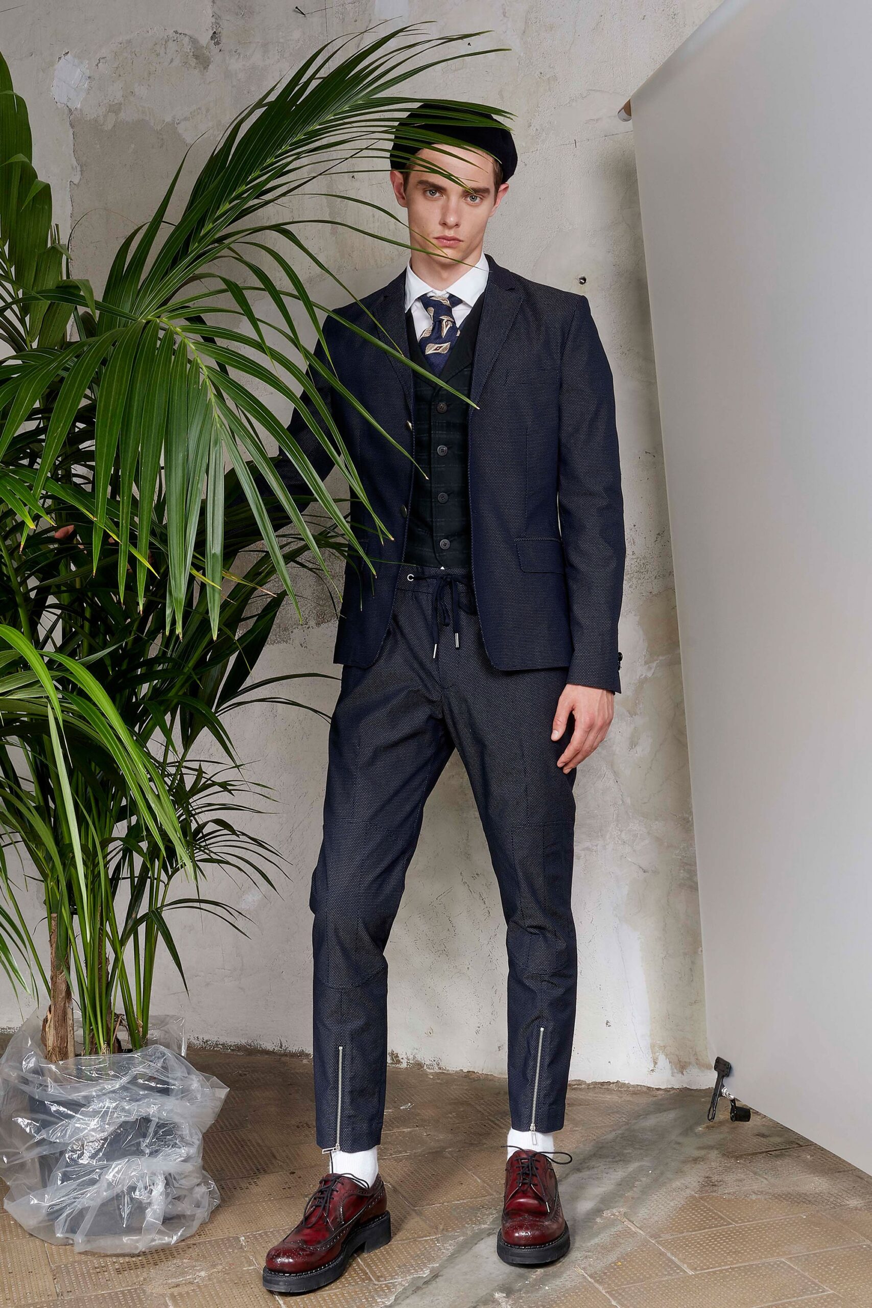 tailored blue suit with brown shoes