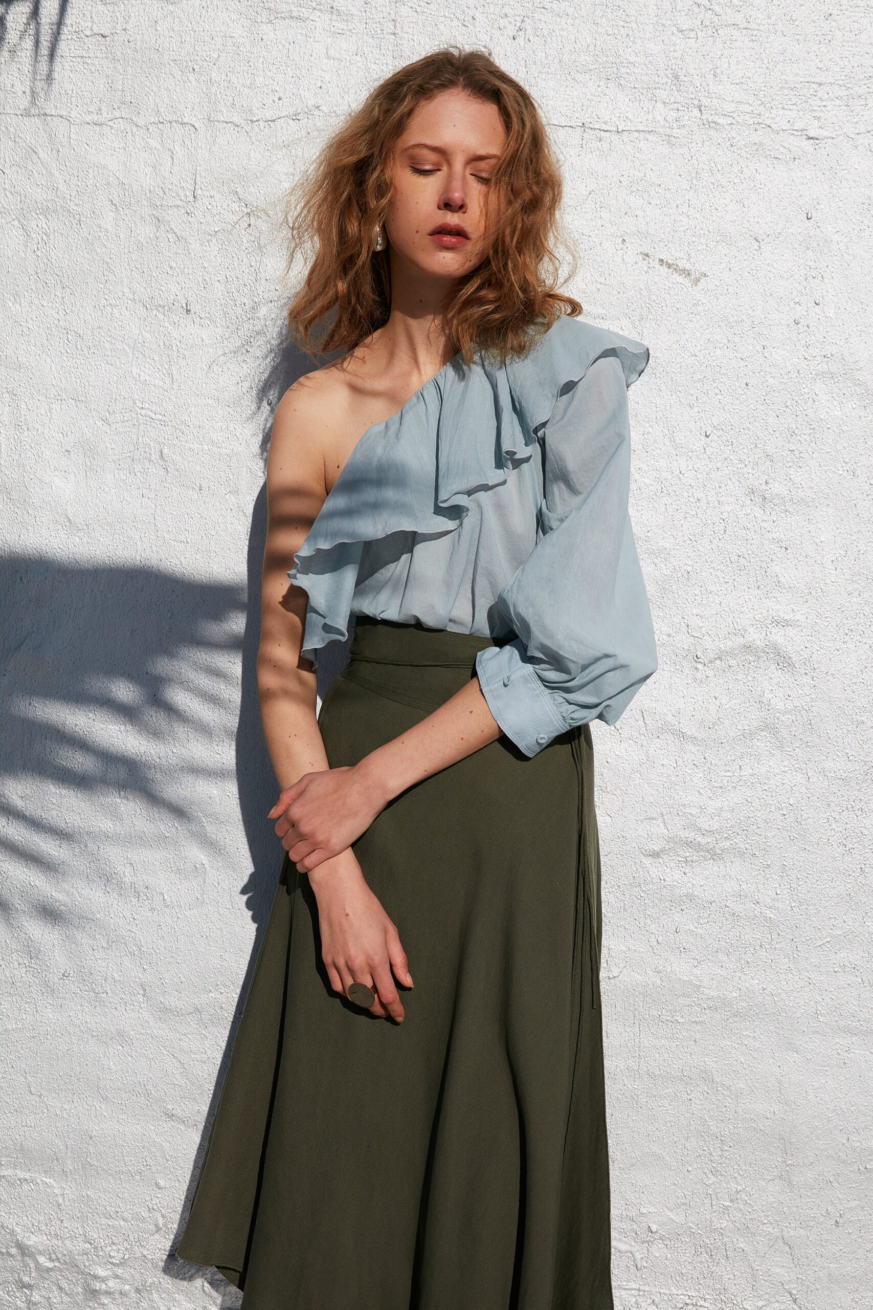 blue cotton long-sleeve off-shoulder relaxed ruffled blouse