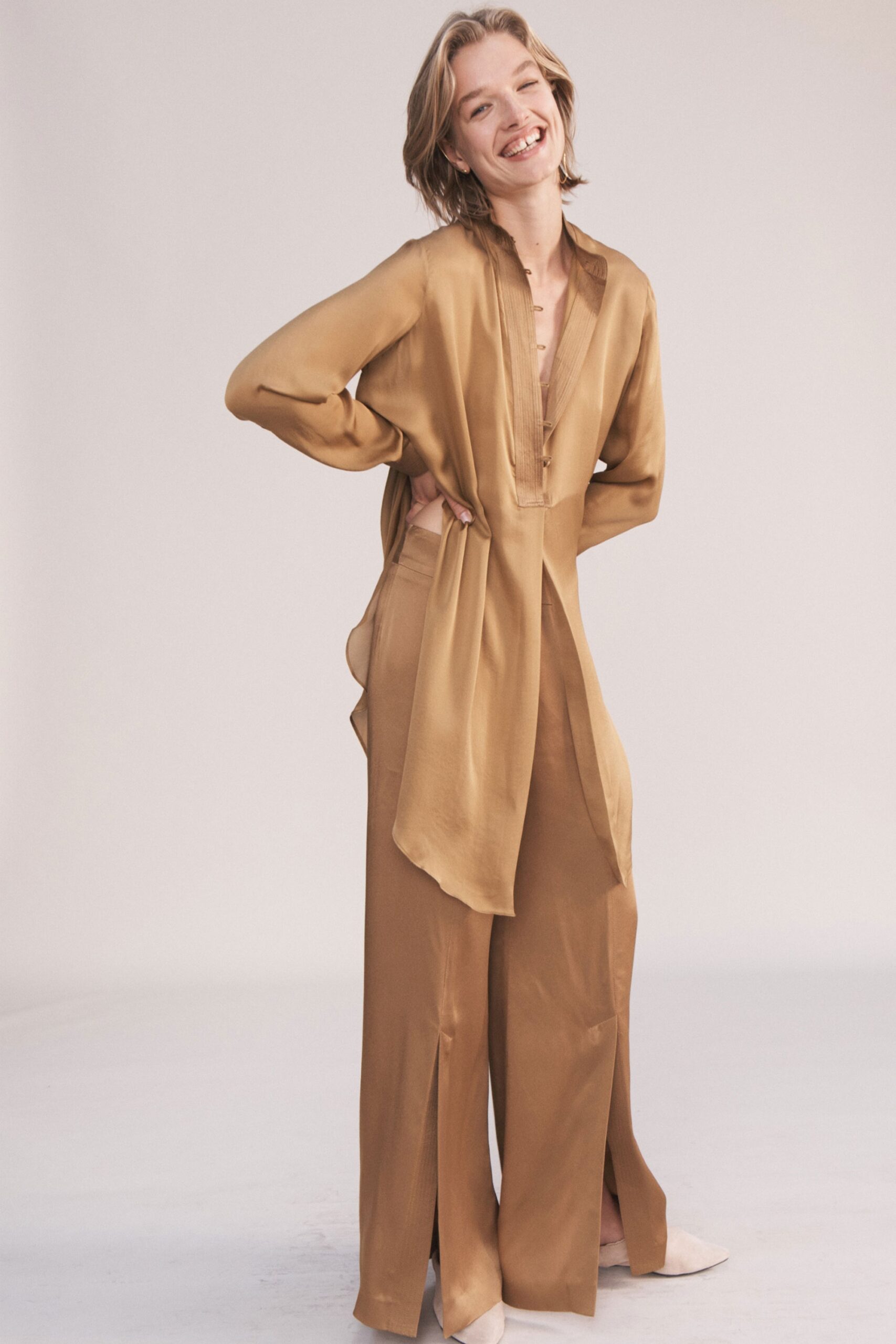 beige silk long-sleeve collared relaxed draped buttoned top