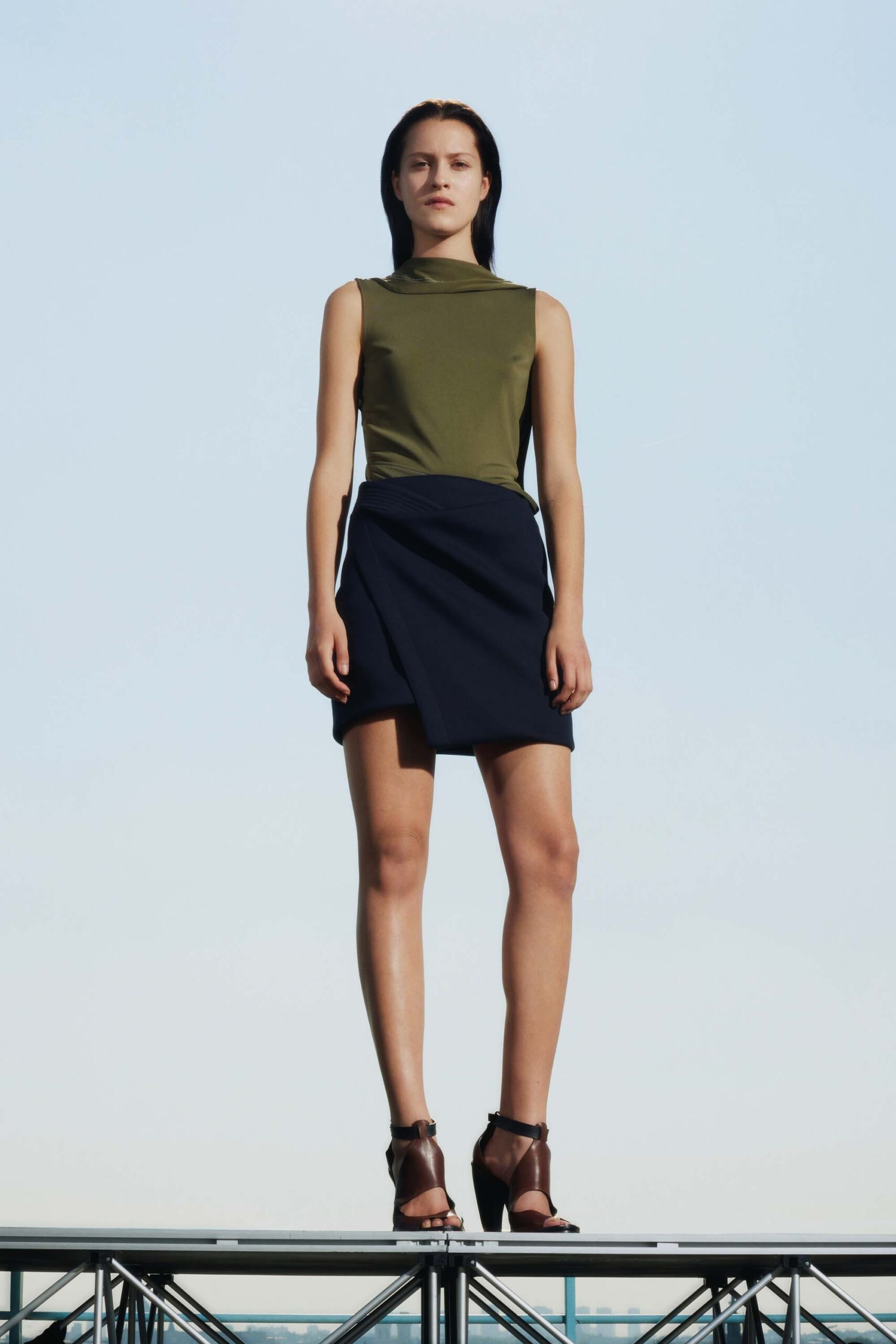 fitted green top and blue skirt